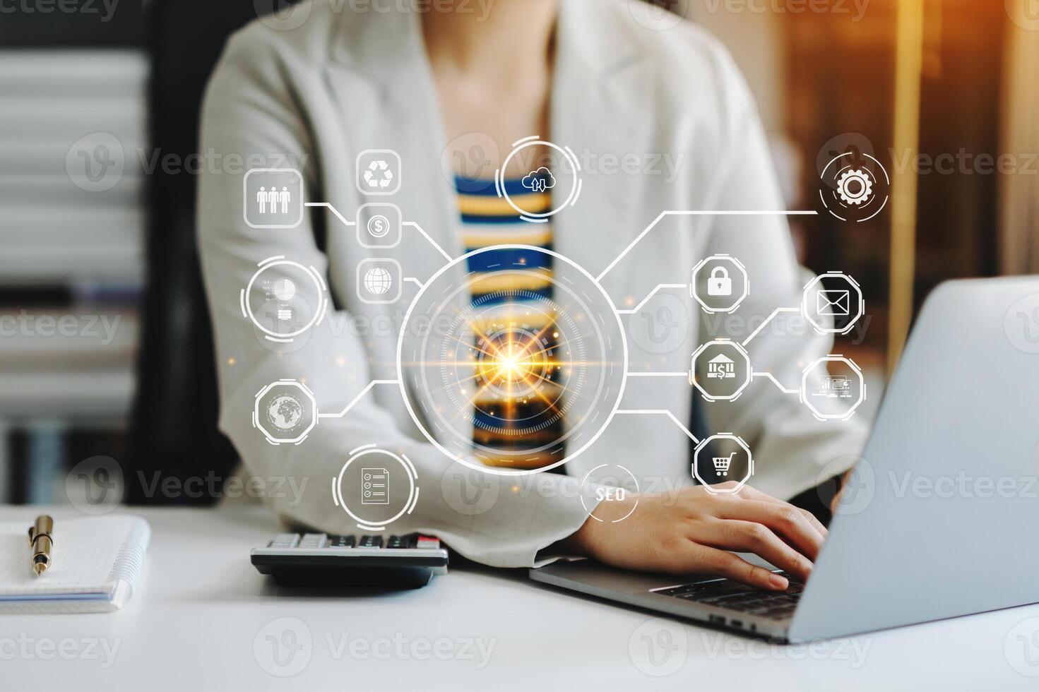 Businesswoman hand working digital marketing media in virtual screen with mobile phone and modern compute with VR icon diagram at office in morning light photo