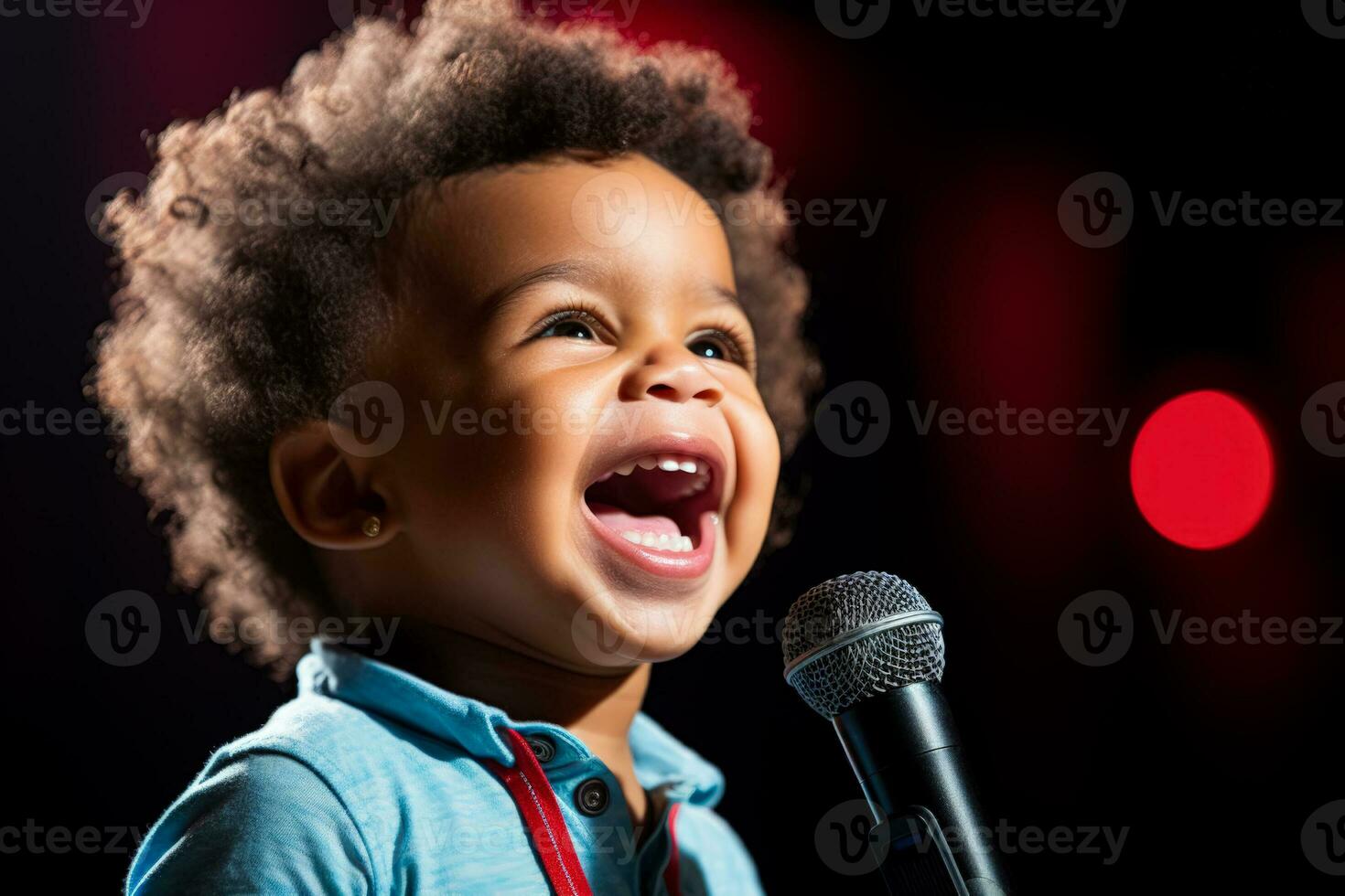 A child nervously gripping a microphone isolated on a spotlight gradient background photo