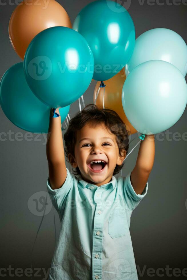 A joyful child playing with colorful balloons isolated on a white background photo