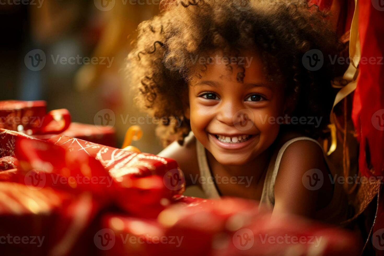 Childs eyes brighten as they unwrap a long awaited present joyously photo