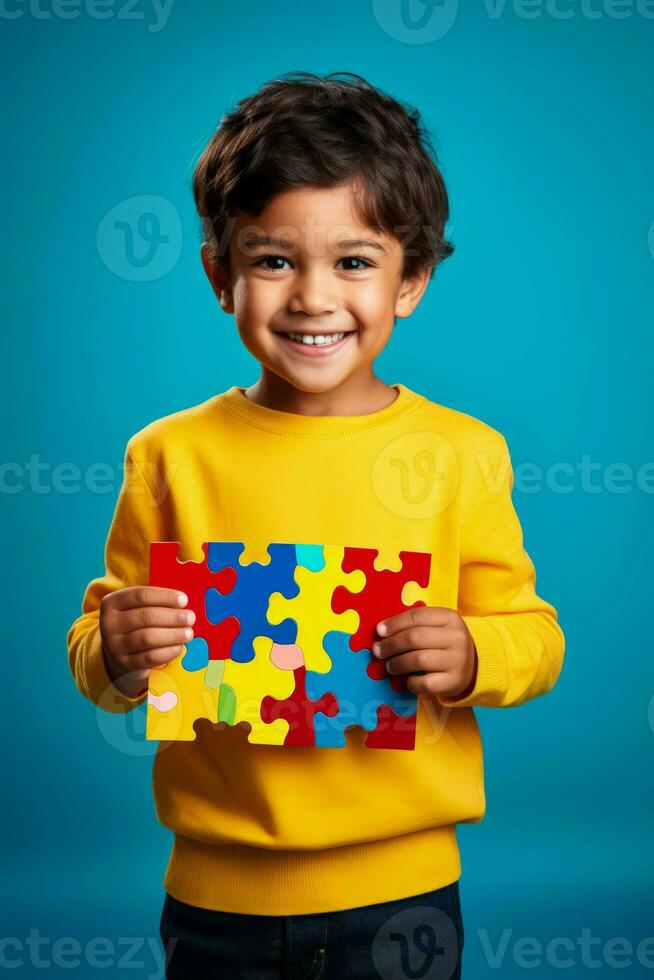 A child proudly showing a completed puzzle isolated on a bright gradient background photo