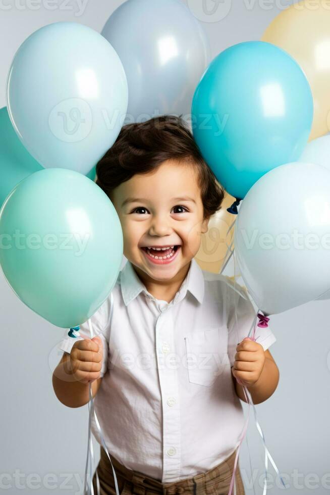 A joyful child playing with colorful balloons isolated on a white background photo