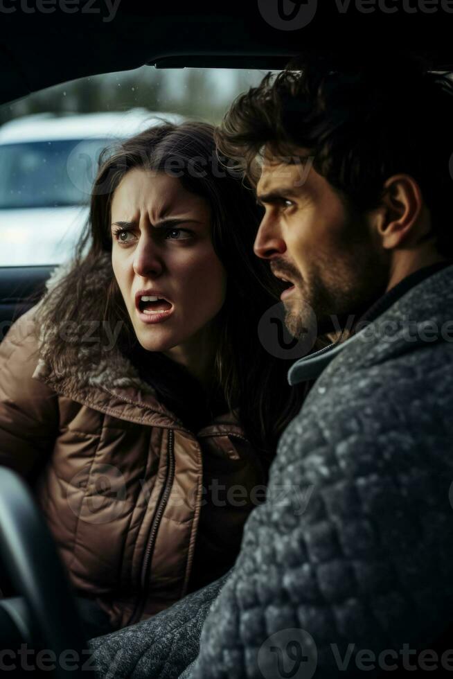 A woman and a man glaring at each other from their car windows in a heated traffic altercation photo