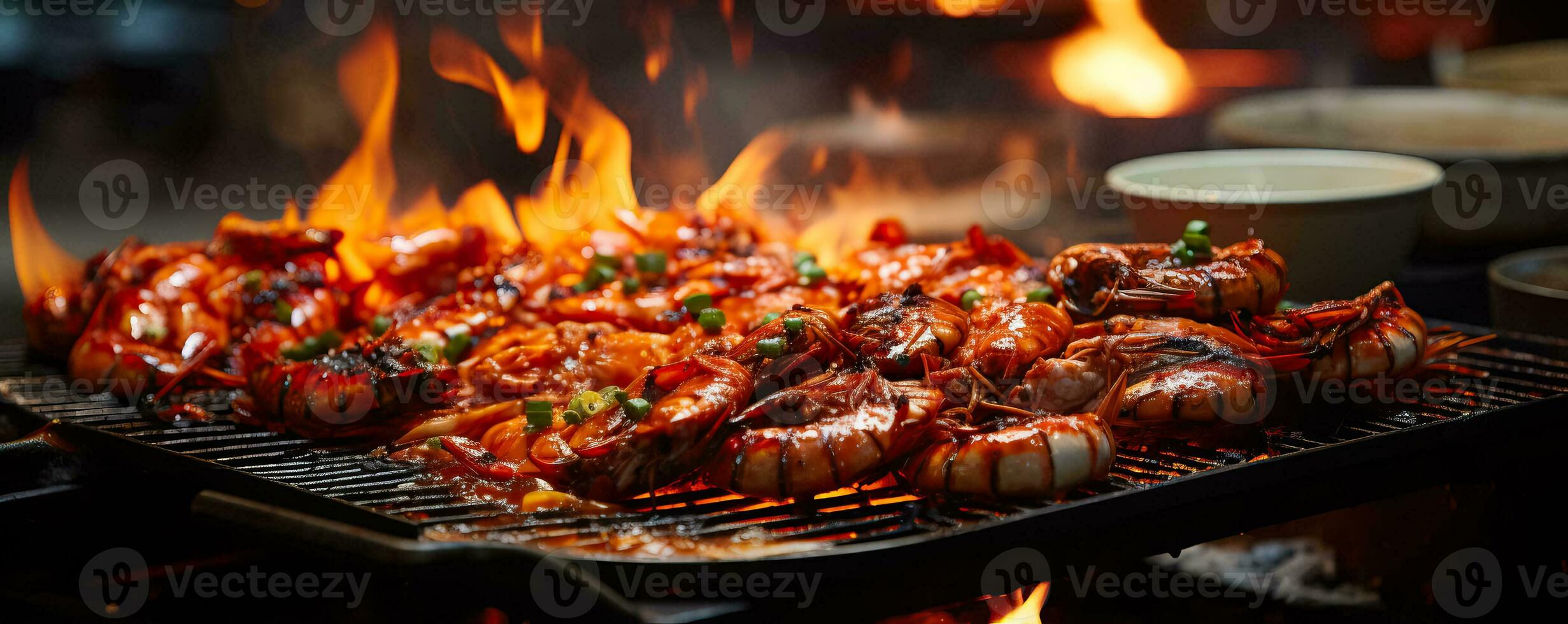 A close-up shot capturing the sizzling flames and aromatic steam as skilled chefs prepare mouthwatering seafood delicacies photo