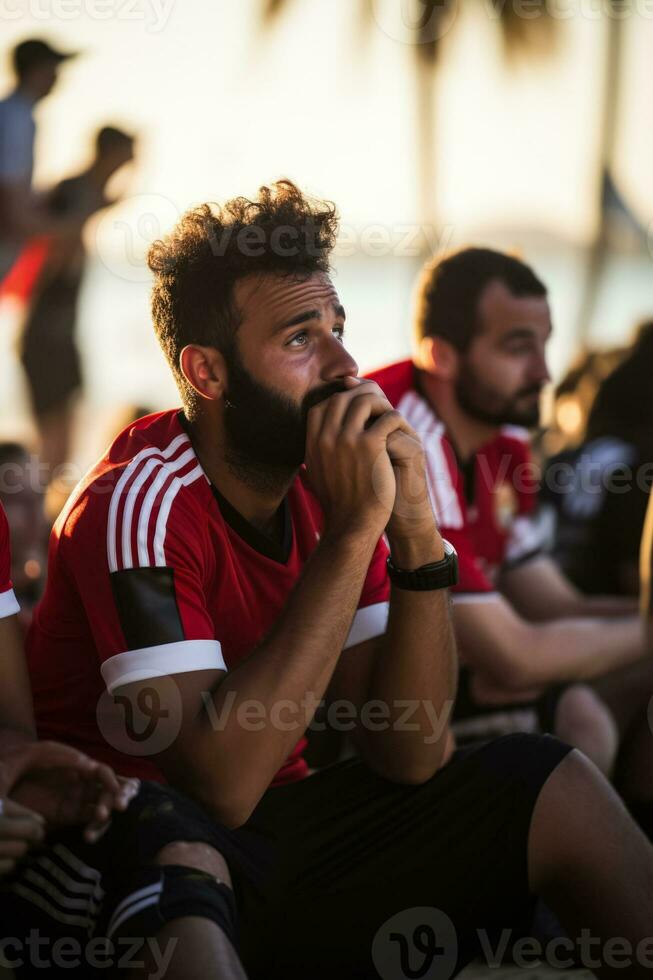 Sad Emirati beach soccer fans photo