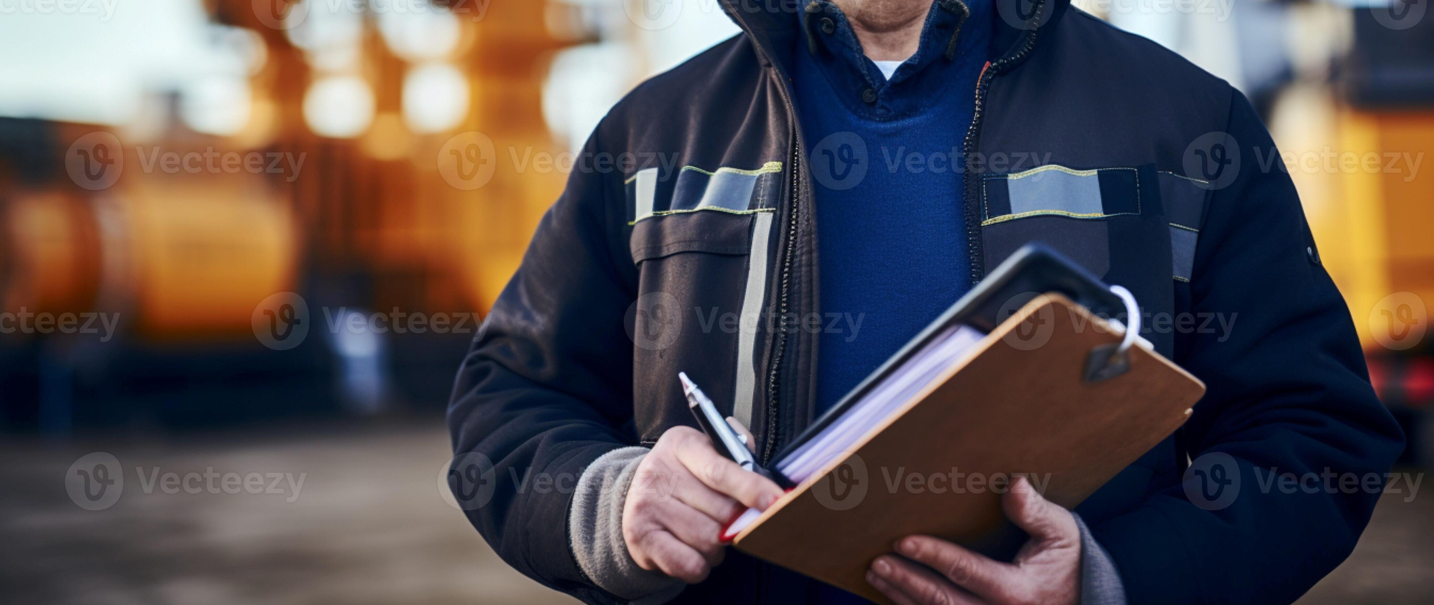 Cropped shot Oil field inspector with helmet holds folder, notes