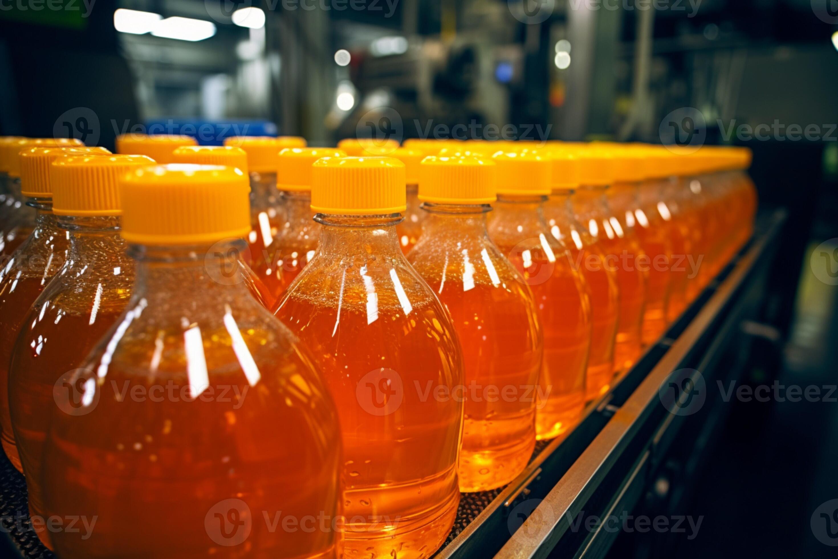 Bottles of juice and water glide along conveyor inside bustling