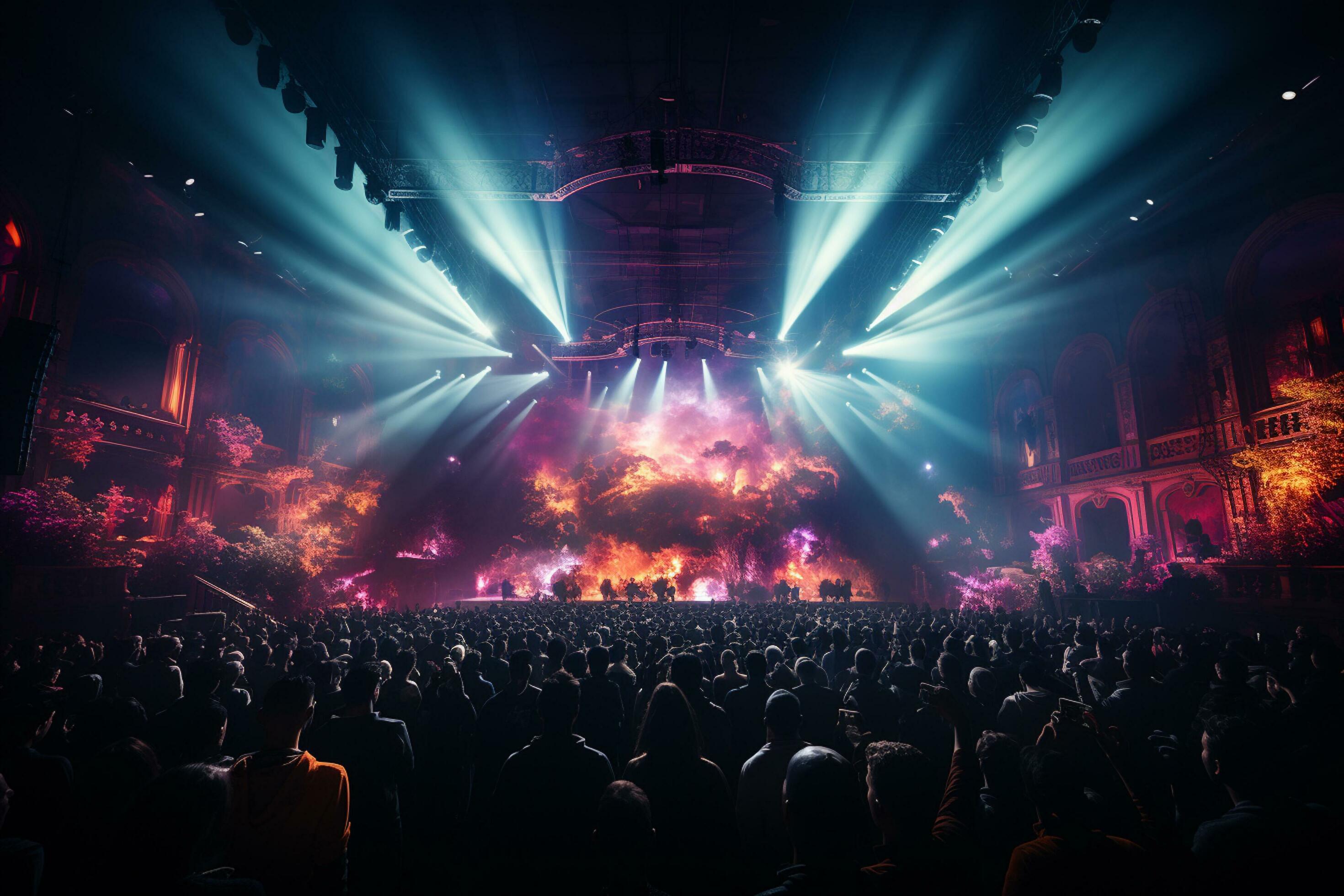 Crowd at a music concert with colorful lights