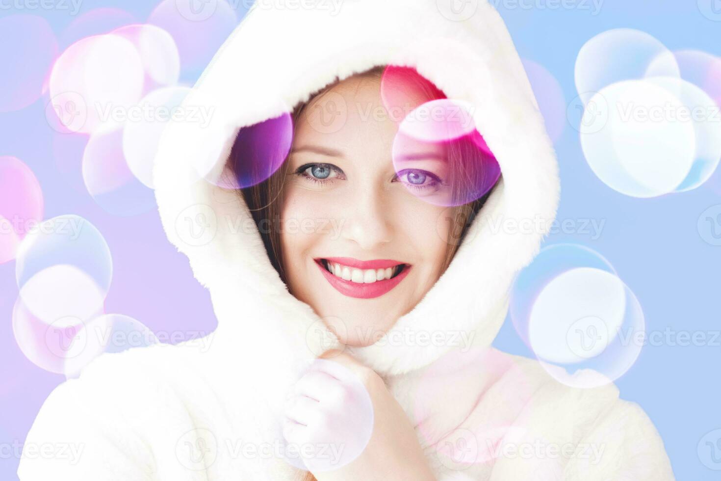 Merry Christmas portrait of smiling young woman wearing fluffy white fur coat, luxury beauty and happy holiday photo