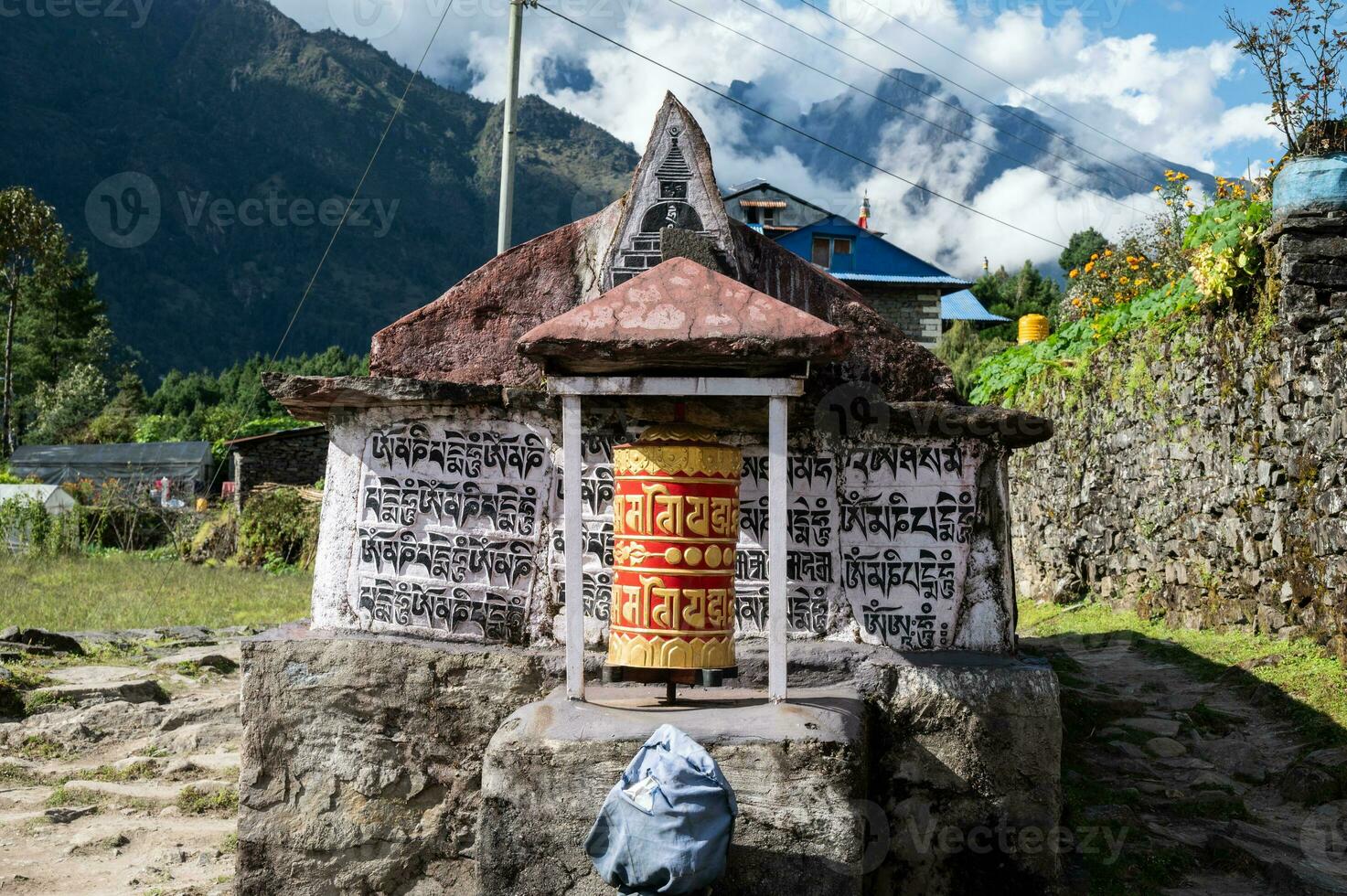 Prayer wheel in countryside village on the way to Namche Bazar, Nepal. photo