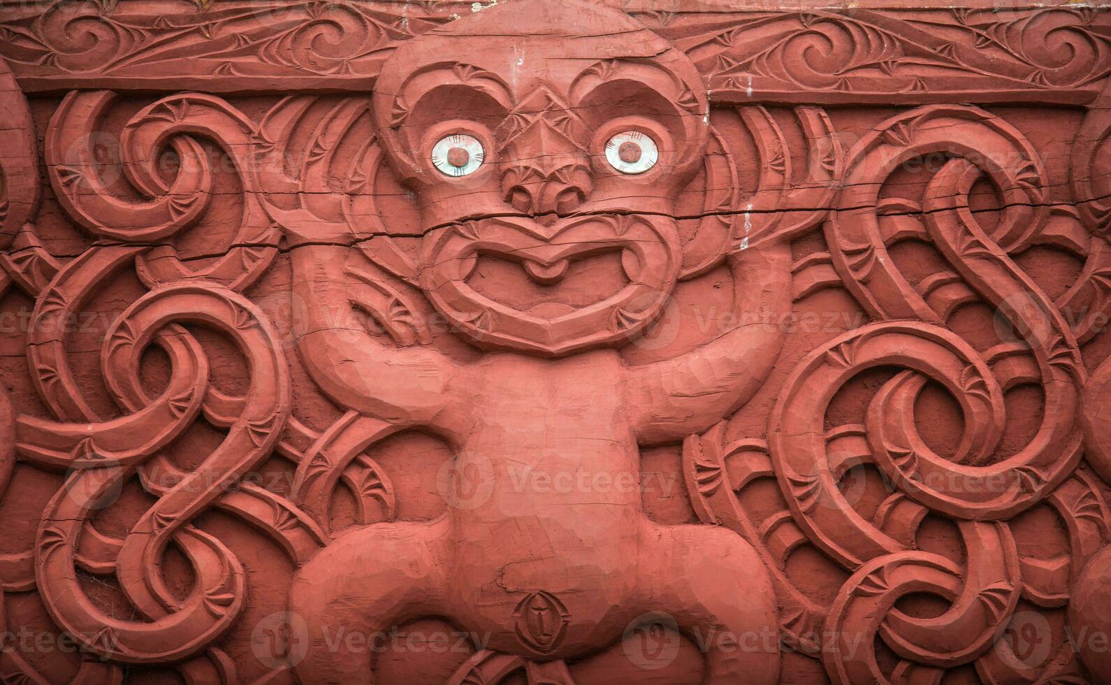 The traditional wood carving in traditional Maori garden in Hamilton gardens an iconic garden in Hamilton, New Zealand. photo