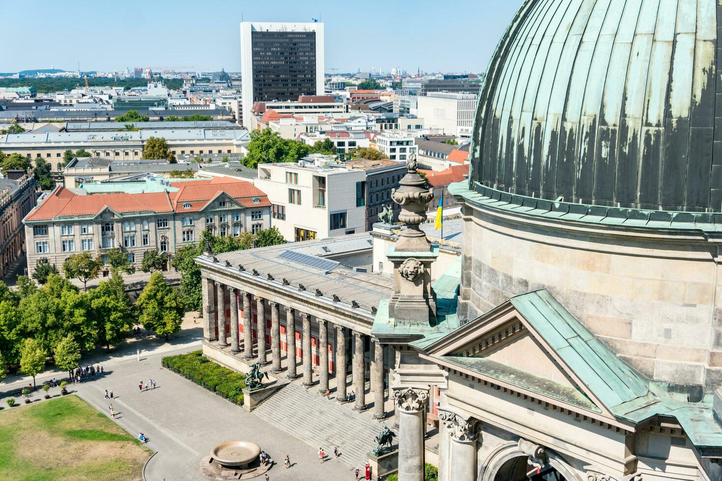 Berlin, Germany-august 9, 2022-view of the statues and landscape outside the dome of the berlin cathedral during a sunny day photo