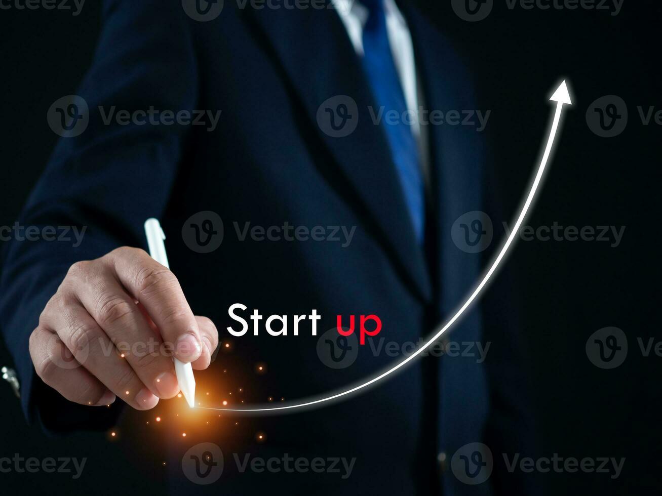 Businessman presses the pen at the starting point to start a business. Startup concept. Business concept. photo