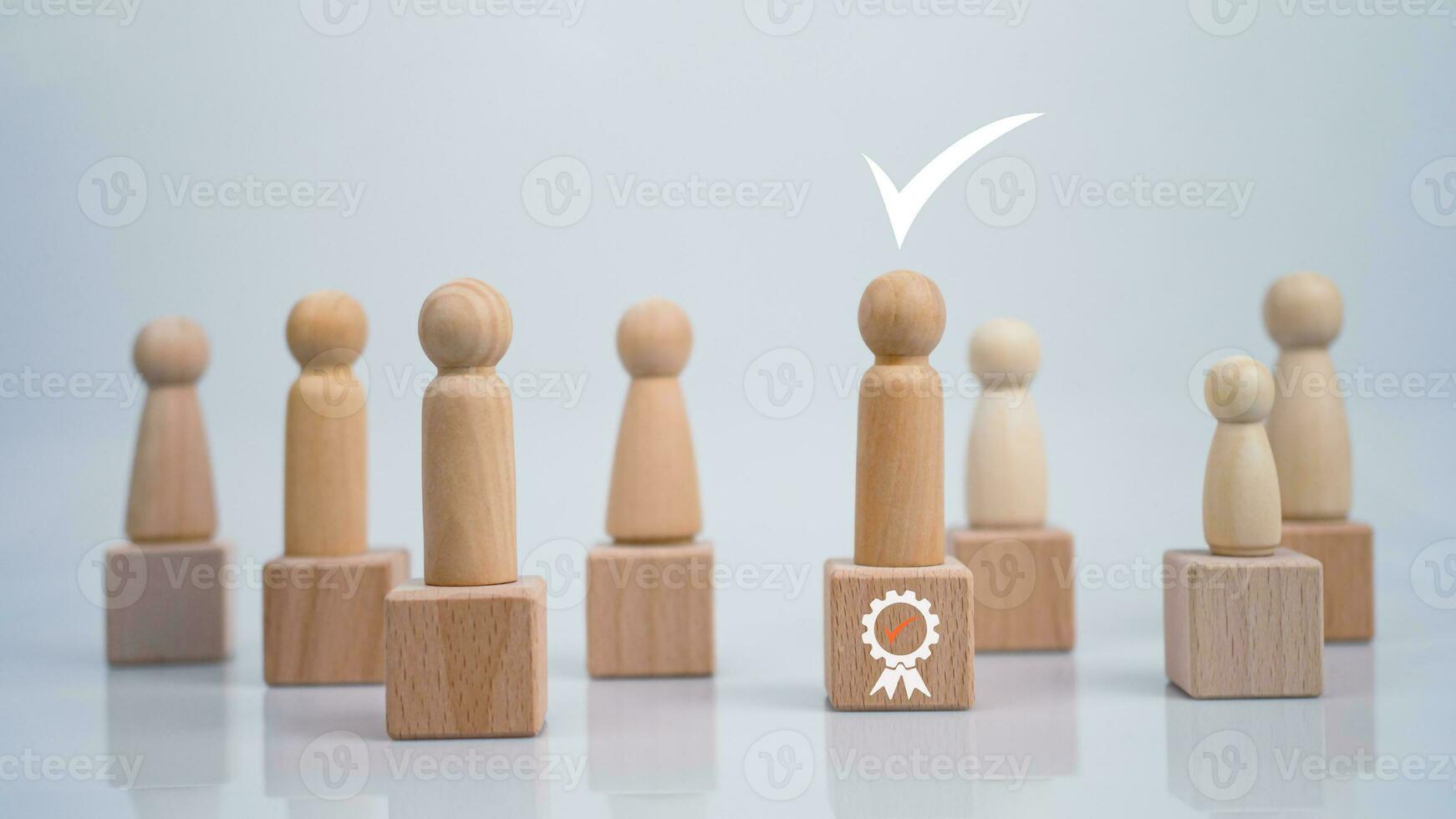 Concept Business and HR for leadership and team leader, one wooden dolls different and stand out from the group. photo