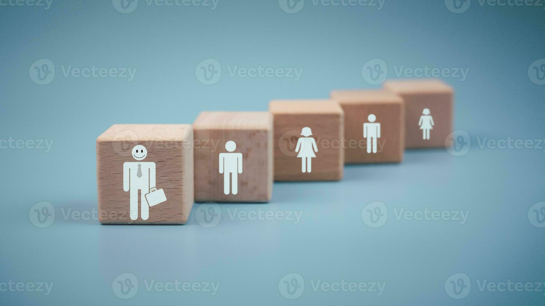 Concept Business and HR for leadership and team leader, one wooden dolls different and stand out from the group. photo