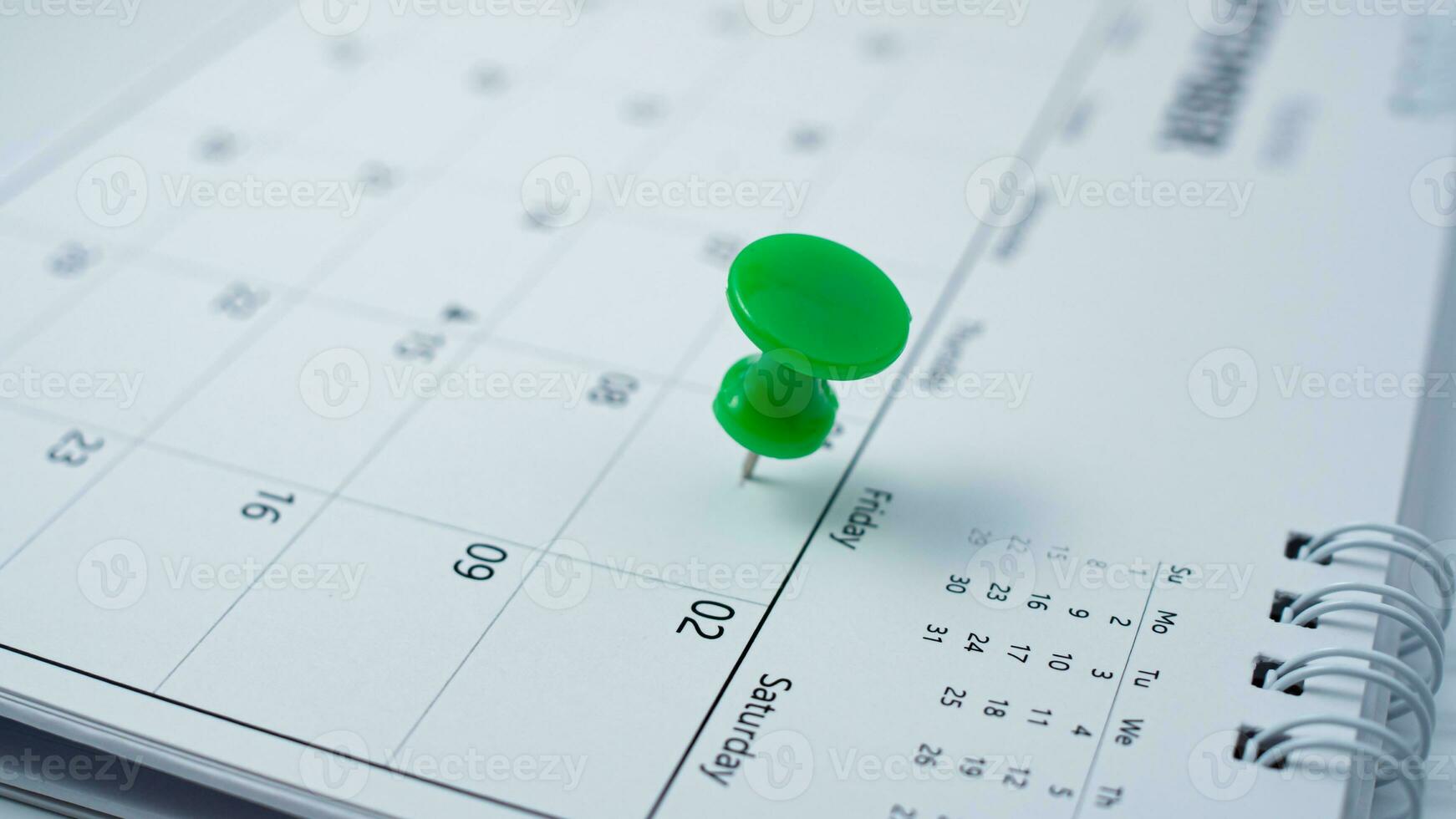 Pinning to the calendar It represents appointments, meeting reminders, planning for business meetings and travel planning concepts. photo