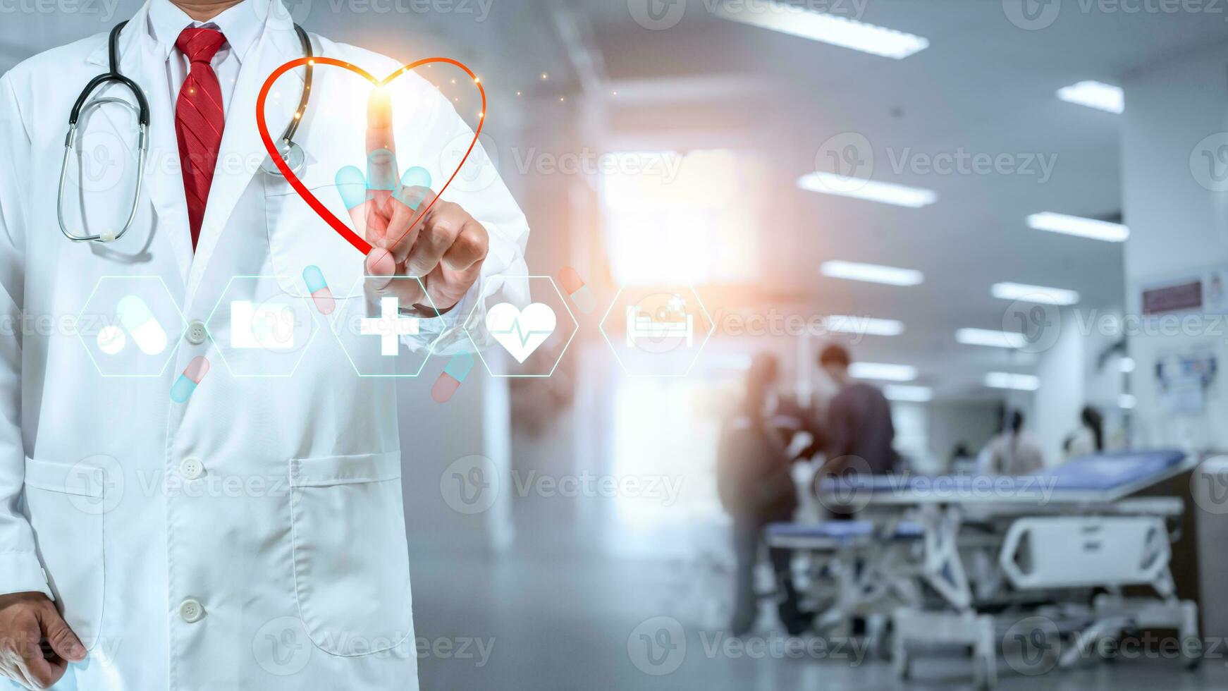 A Doctor showing a red heart at hospital . Medical health care and doctor staff service concept. photo