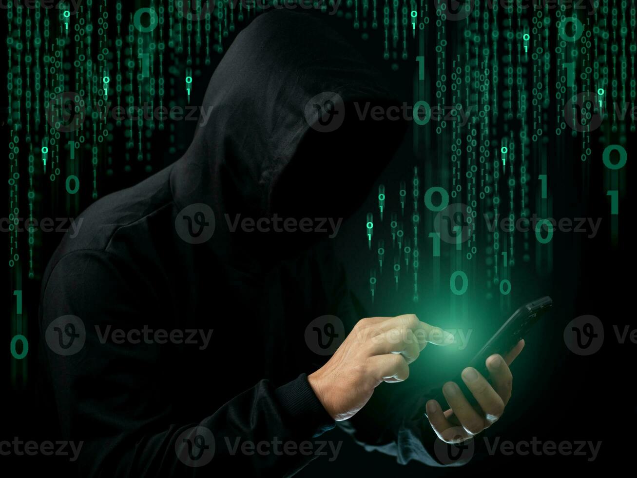 Hackers work on phone in the dark. The concept of information security in the Internet network and information espionage. photo