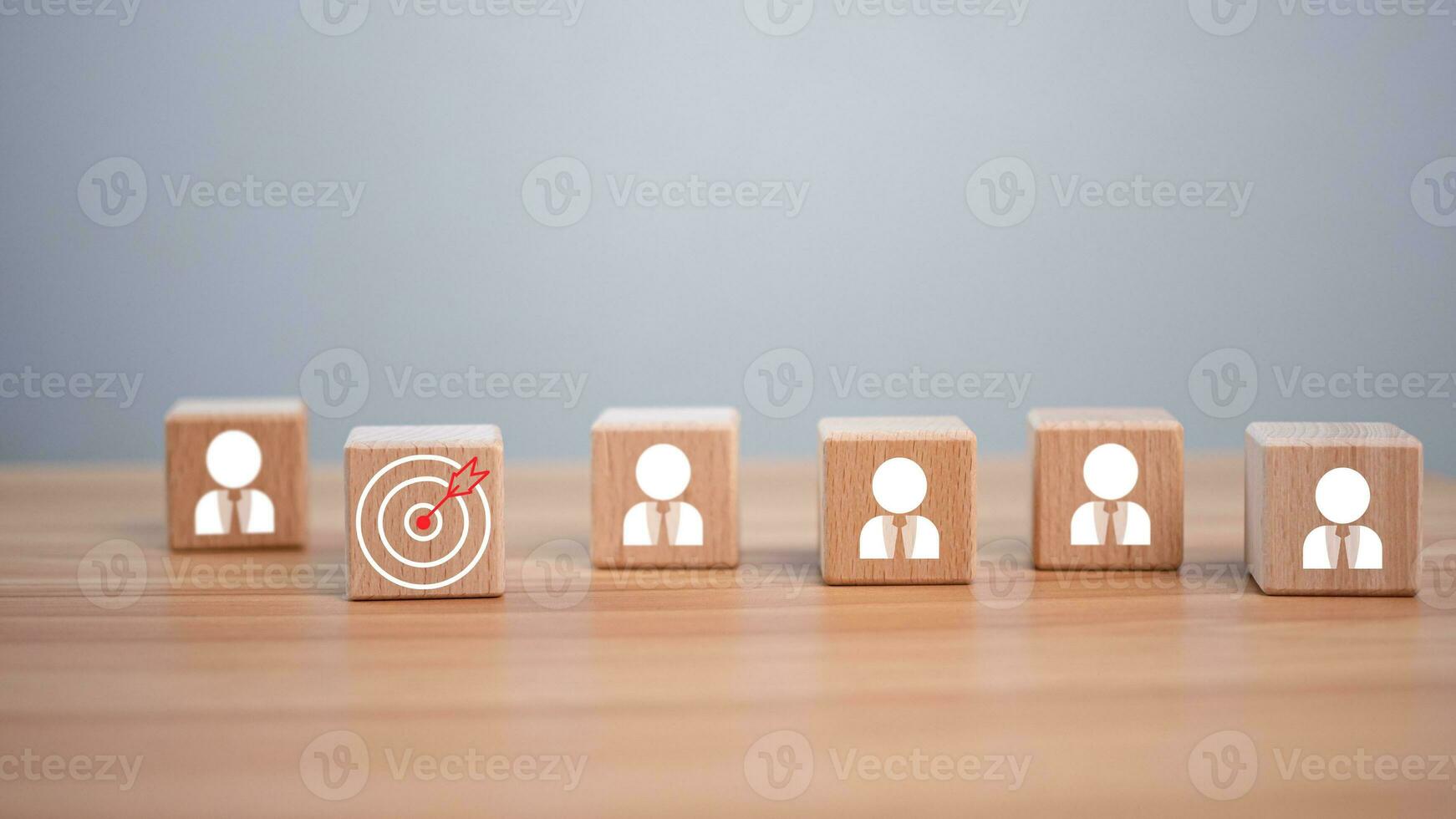 wooden block which prints a target icon and business symbol on white background. Business goals and objectives concept. business competition. business target concept. photo