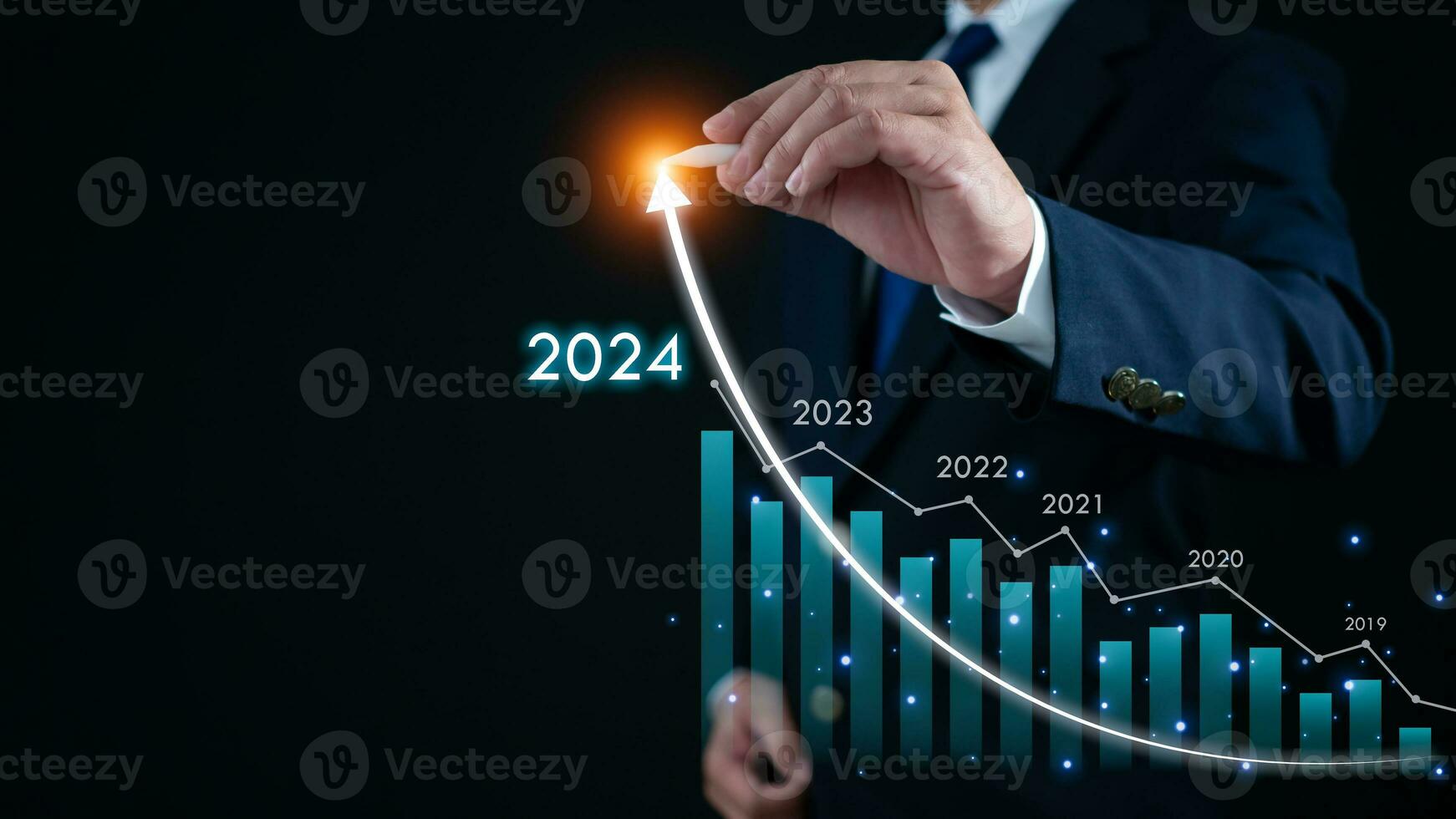 Stock trading. Finance. Investing. Growing business. Businessman in suit pointing with a pen at the tip of an arrow and a graph bar Represents business growth in 2024. photo