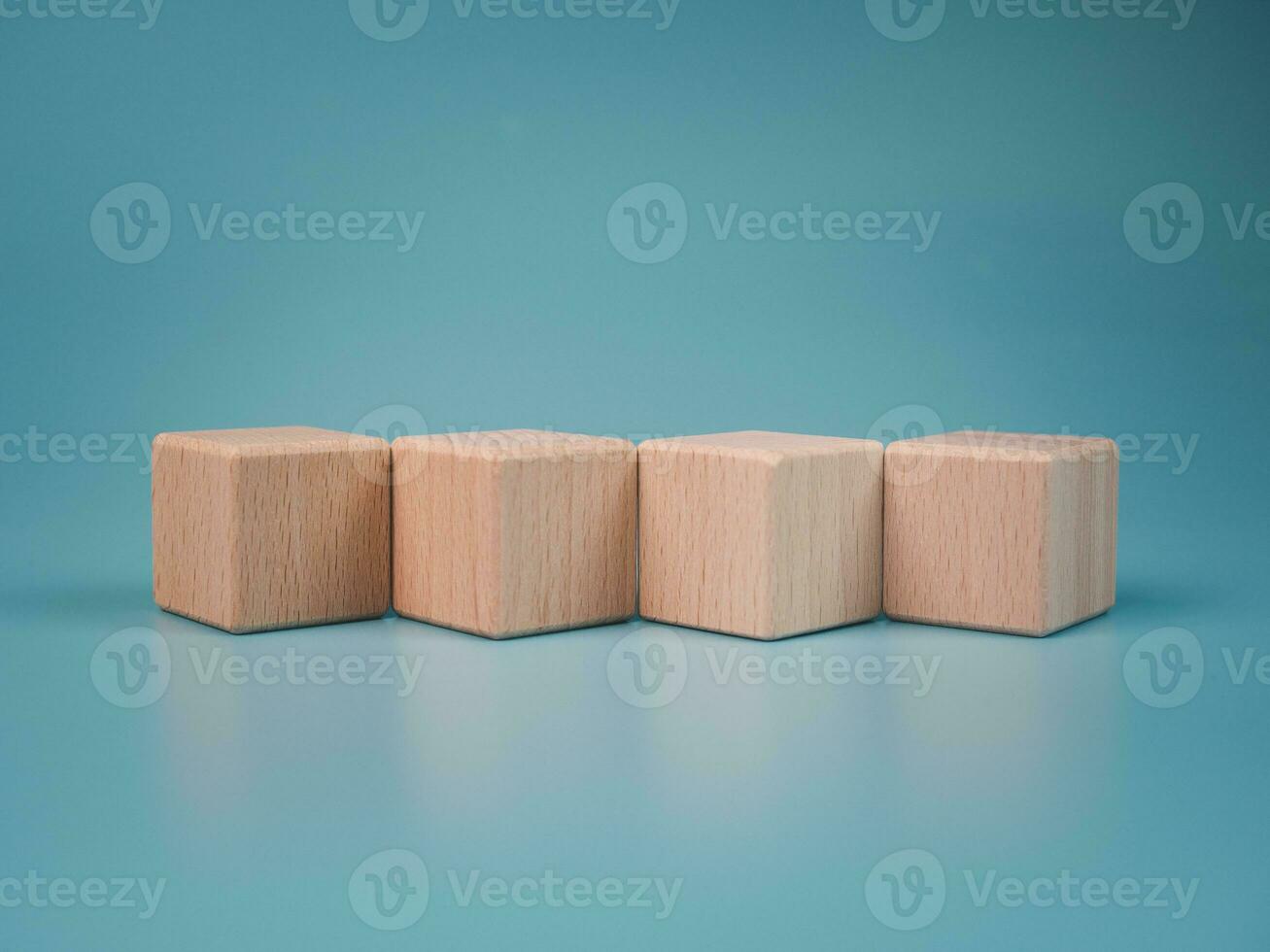 empty wooden blocks lined up on light blue background. Business concept,object. photo