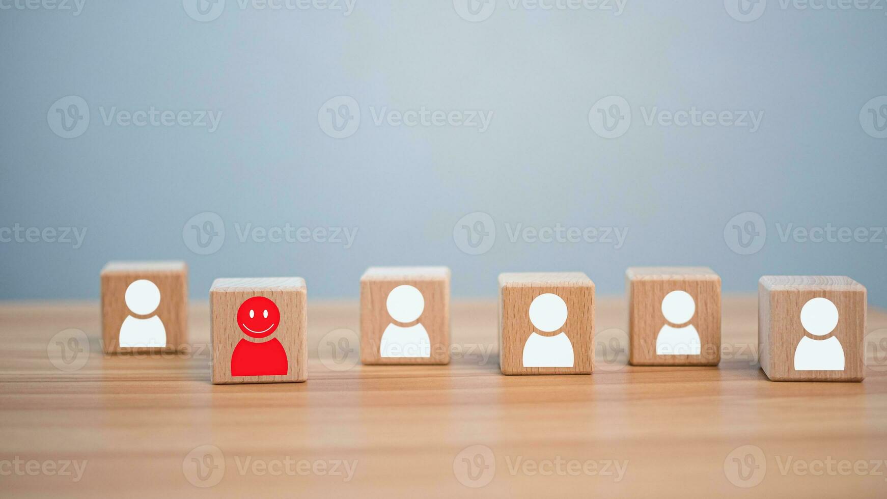 Concept Business and HR for leadership and team leader, one wooden dolls different and stand out from the group. photo