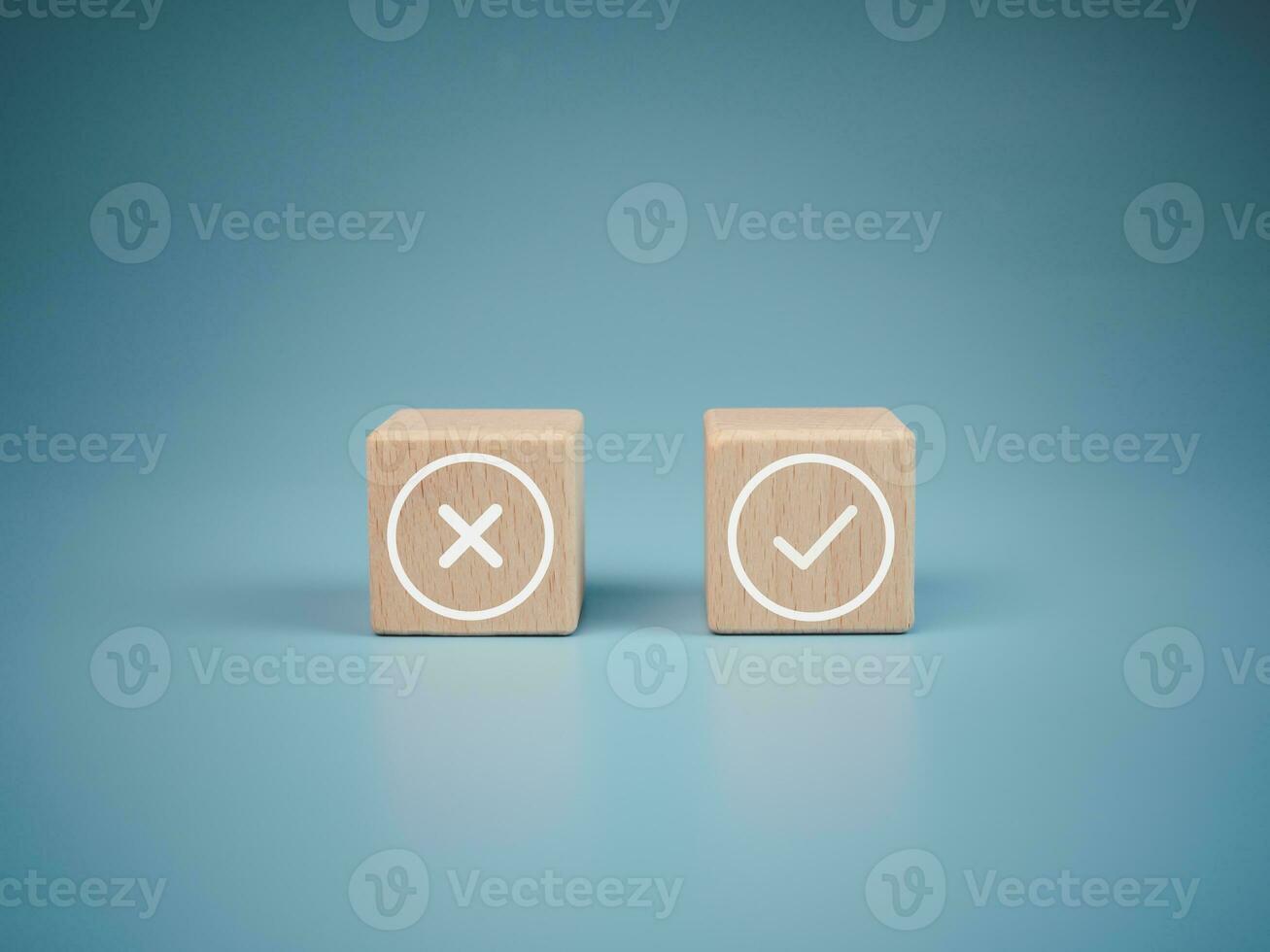 Wooden blocks with wrong and right symbols on light blue background. photo