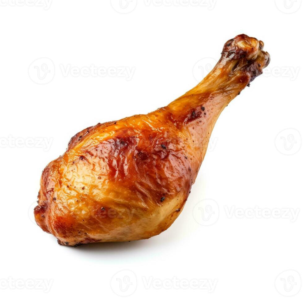 Crisp golden roasted chicken drumstick starkly isolated on a white background photo