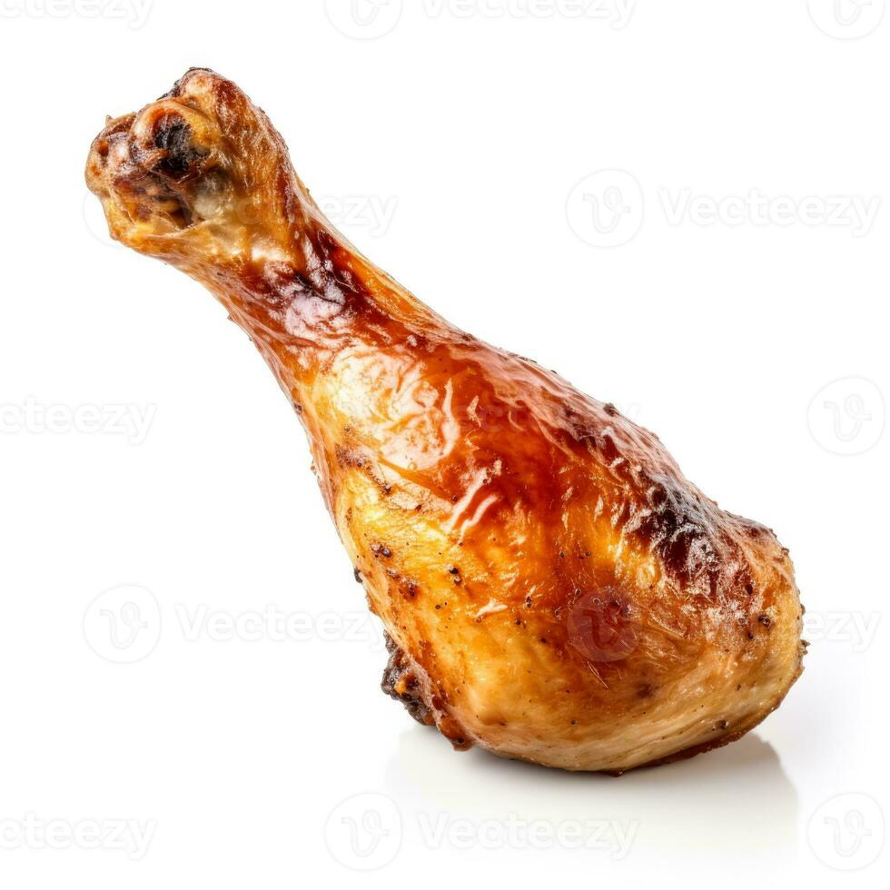 Glistening roasted chicken drumstick meticulously isolated on pure white background photo