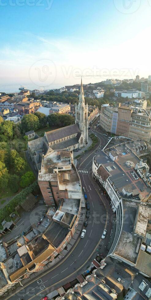 Vertical Aerial Panoramic of British Tourist Attraction at Sea View of Bournemouth City of England Great Britain UK. High Angle Image Captured with Drone's Camera on September 9th, 2023 During Sunset photo