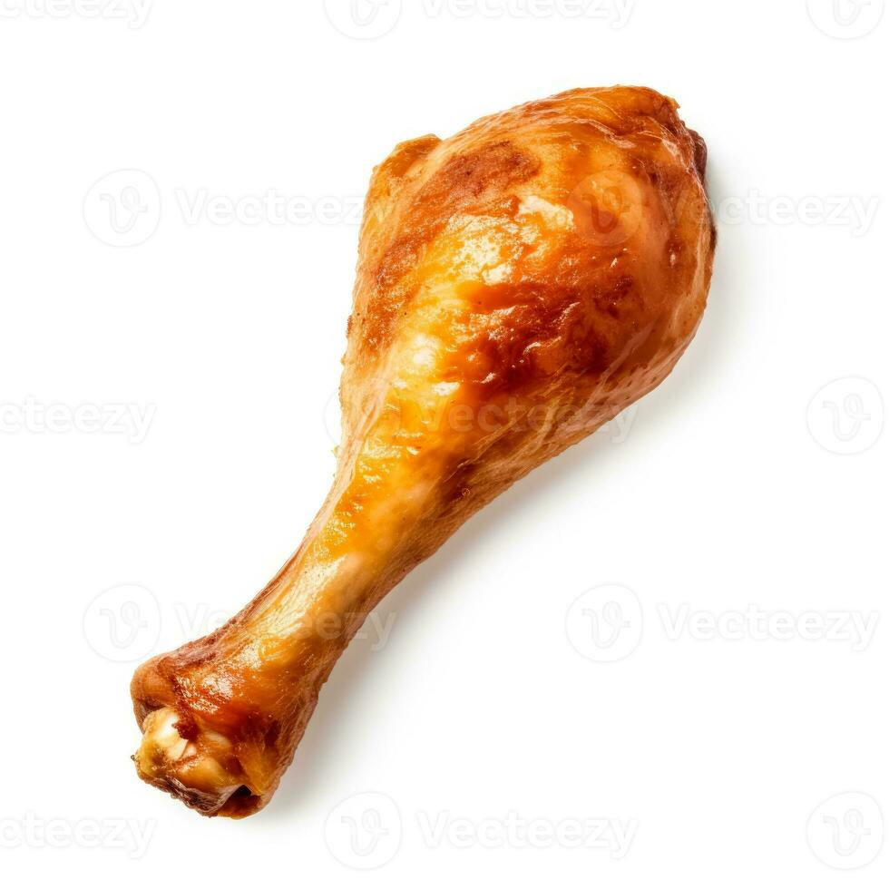 Crisp golden roasted chicken drumstick starkly isolated on a white background photo