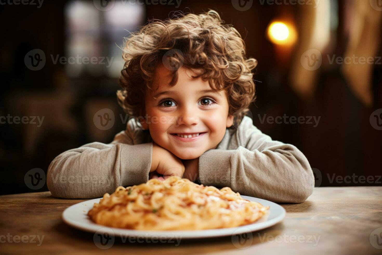 Young child savouring pasta in Italian eatery background with empty space for text photo