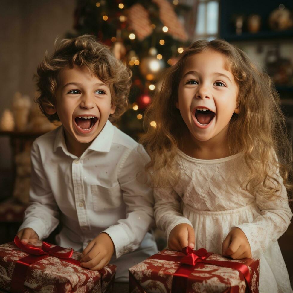 Excited children opening their presents on Christmas morning photo
