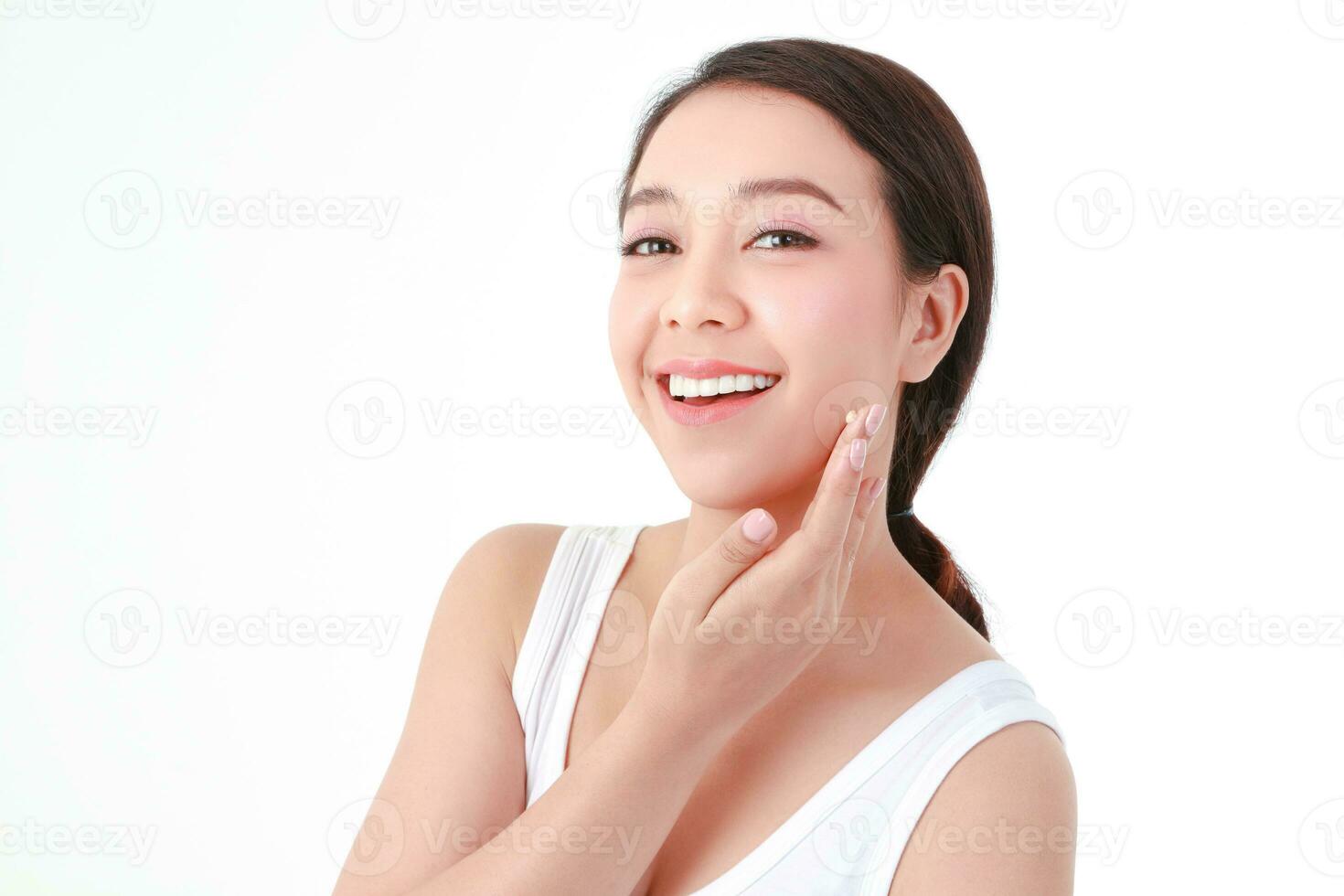 beautiful asian woman Have a beautiful smile, clean white teeth. Take care of the health of your face with skin creams. Beauty concept. white background photo