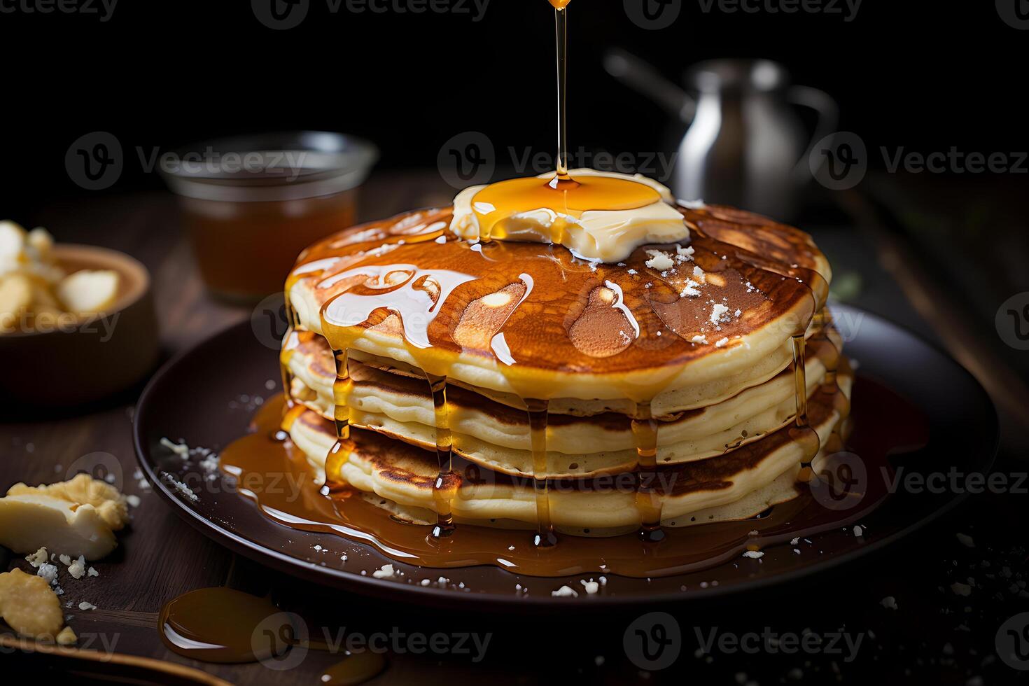 Pancakes with butter honey and maple syrup photo