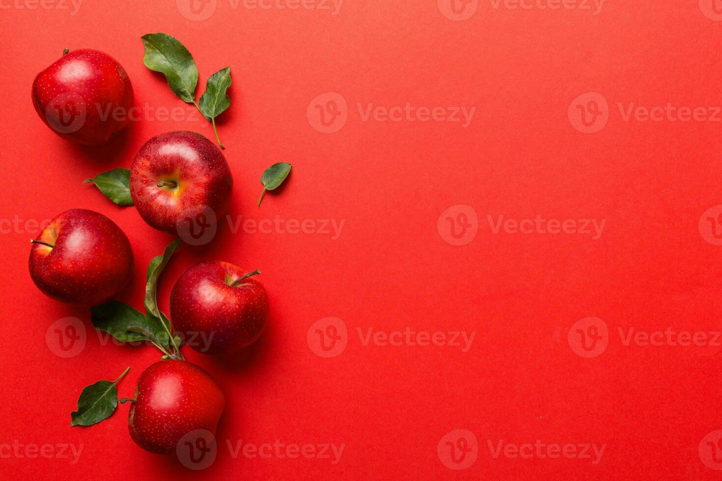 Many red apples on colored background, top view. Autumn pattern with fresh apple above view with copy space for design or text photo