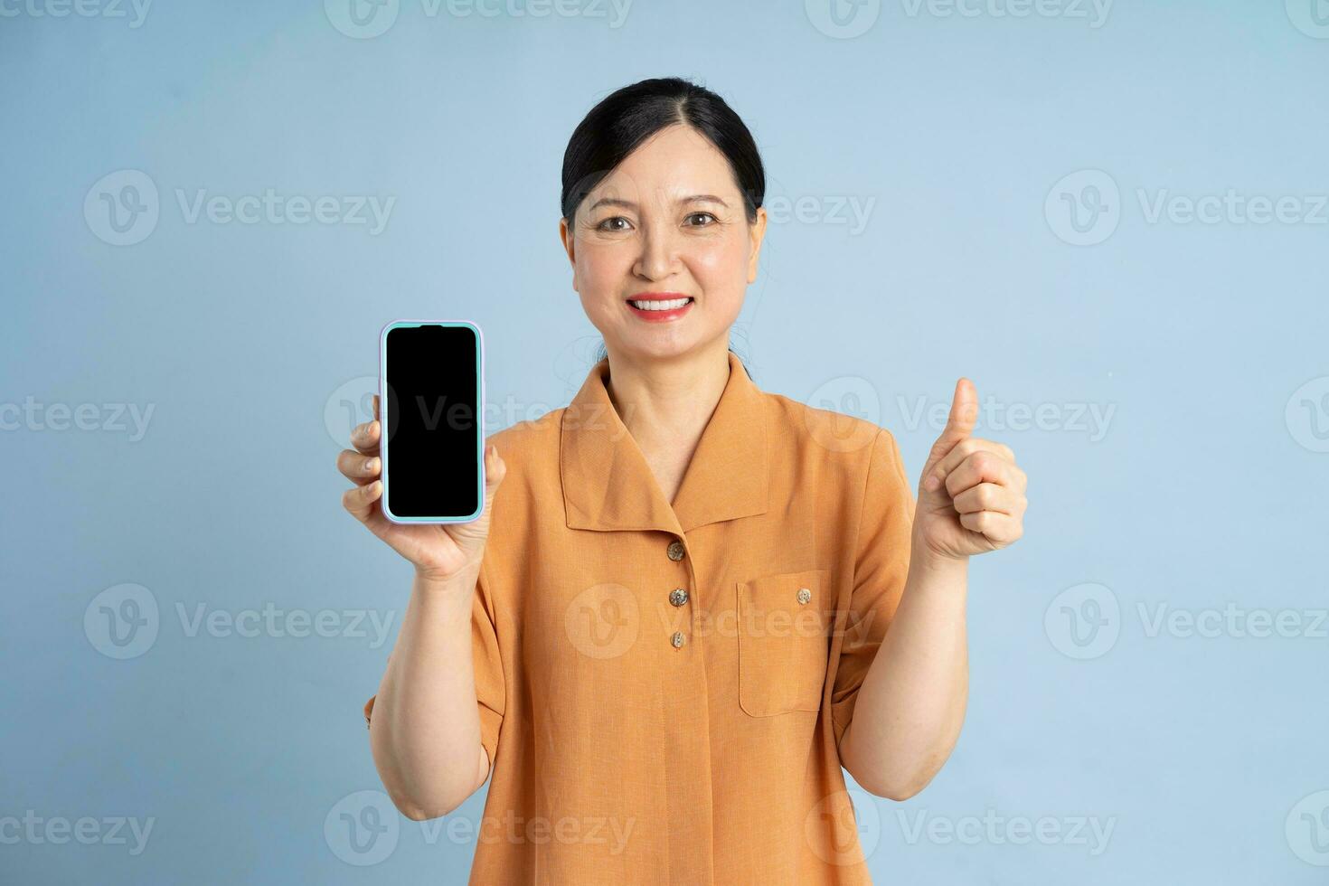 Portrait of an elderly woman using a smartphone photo
