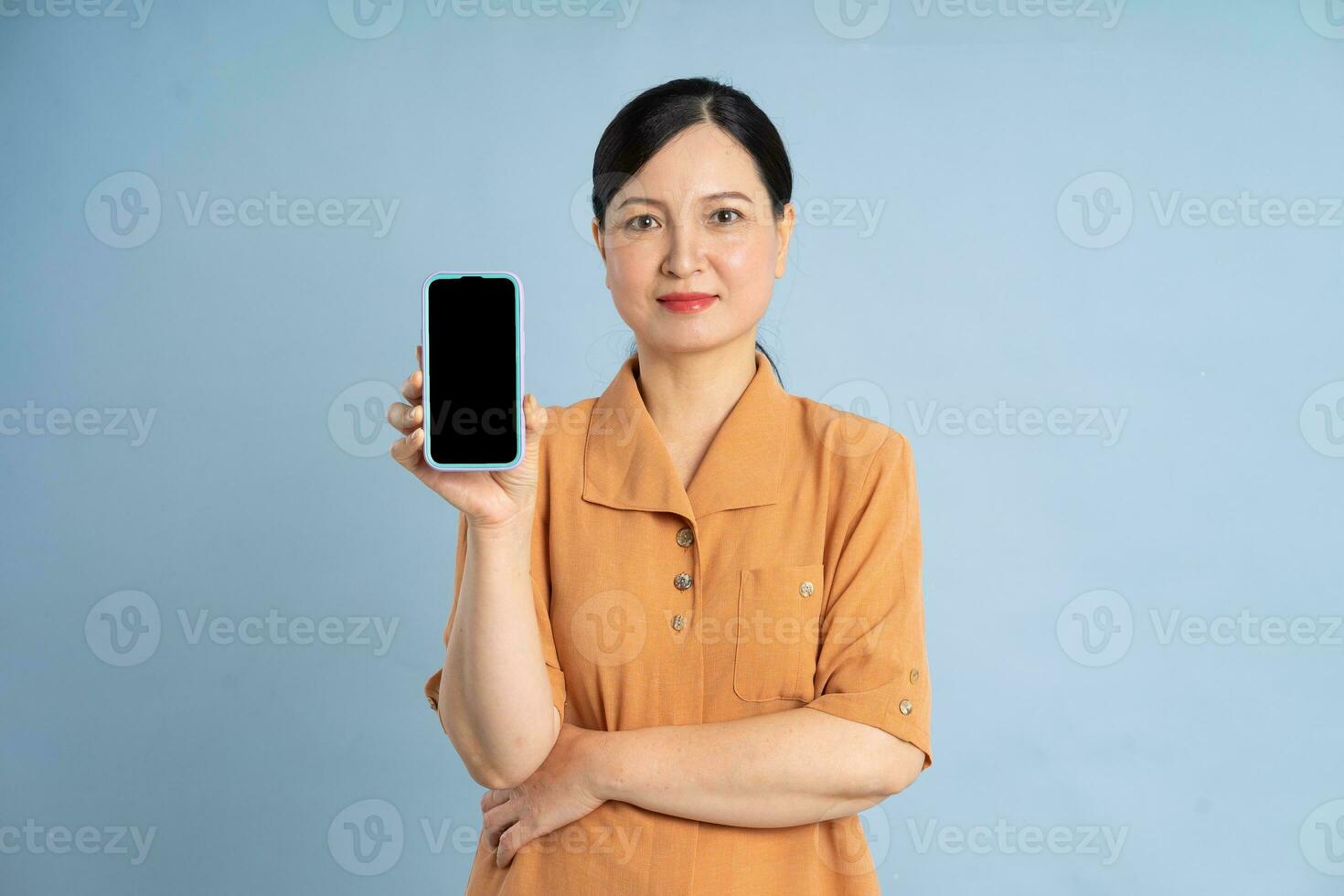 Portrait of an elderly woman using a smartphone photo