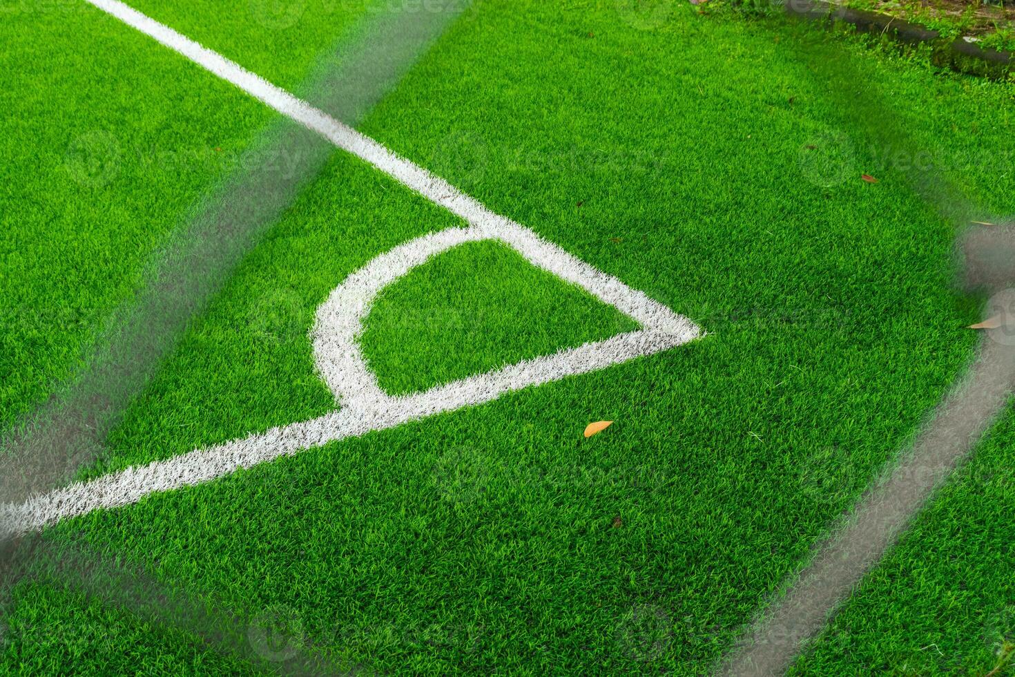 A soccer field view from outside the fence, focusing on the field, after some edits. photo