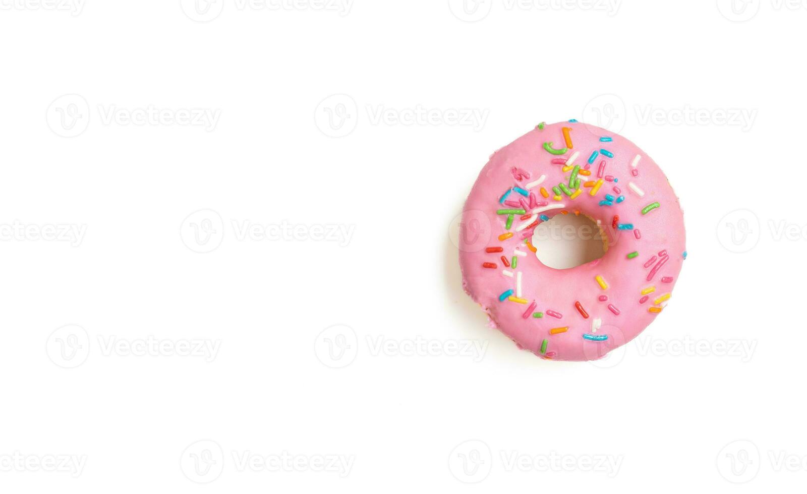 Edited photo. Messy strawberry doughnut isolated on white background. photo