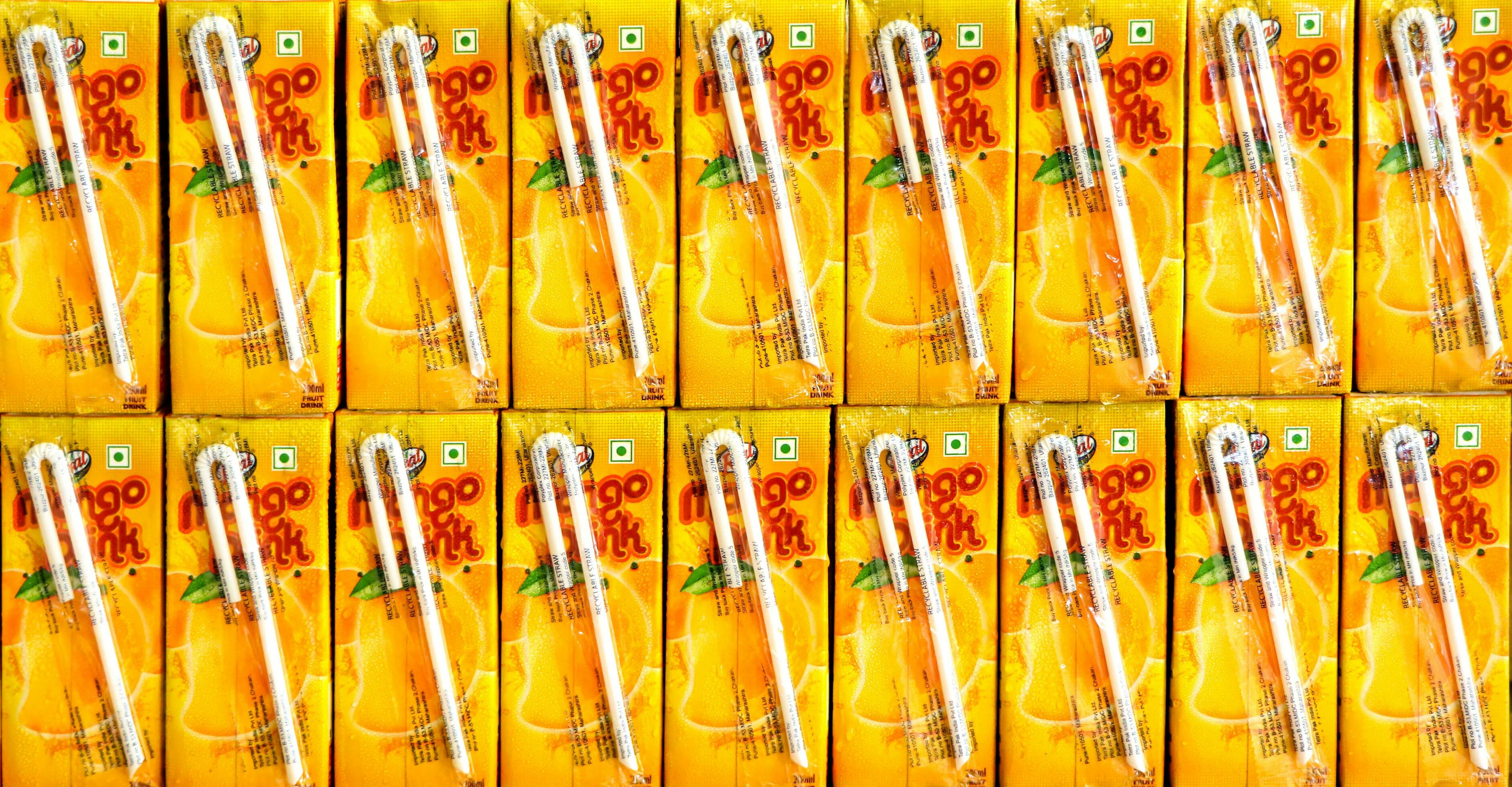 Full frame of mango juice boxes for sale at a grocery store in India