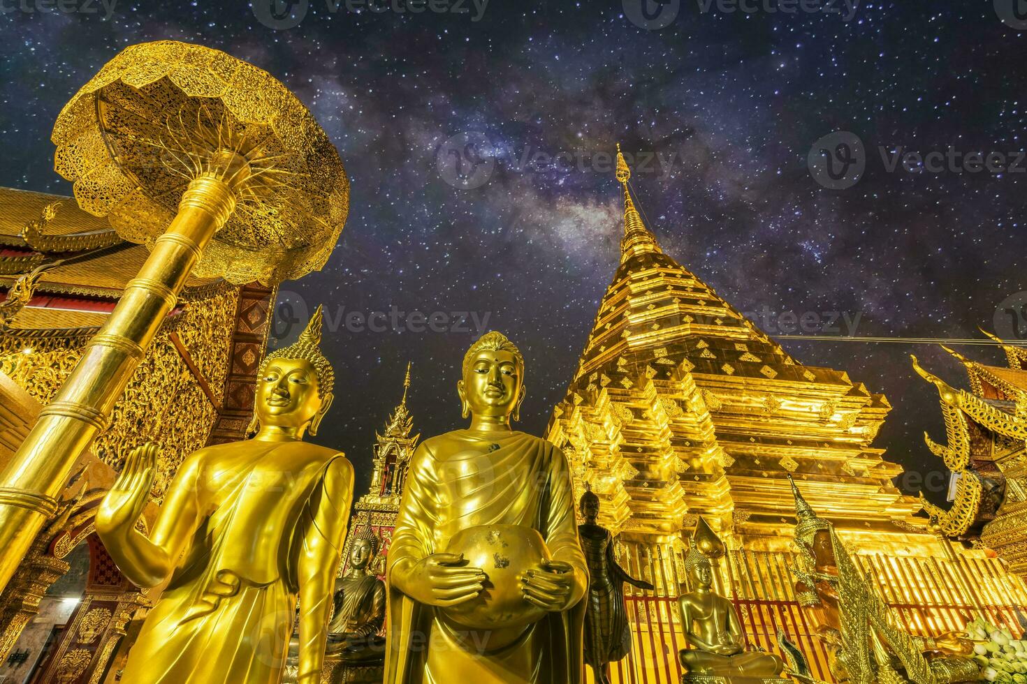 The Night starry sky Milky way and Wat Phra That Doi Suthep is tourist attraction of Chiang Mai, Thailand. photo