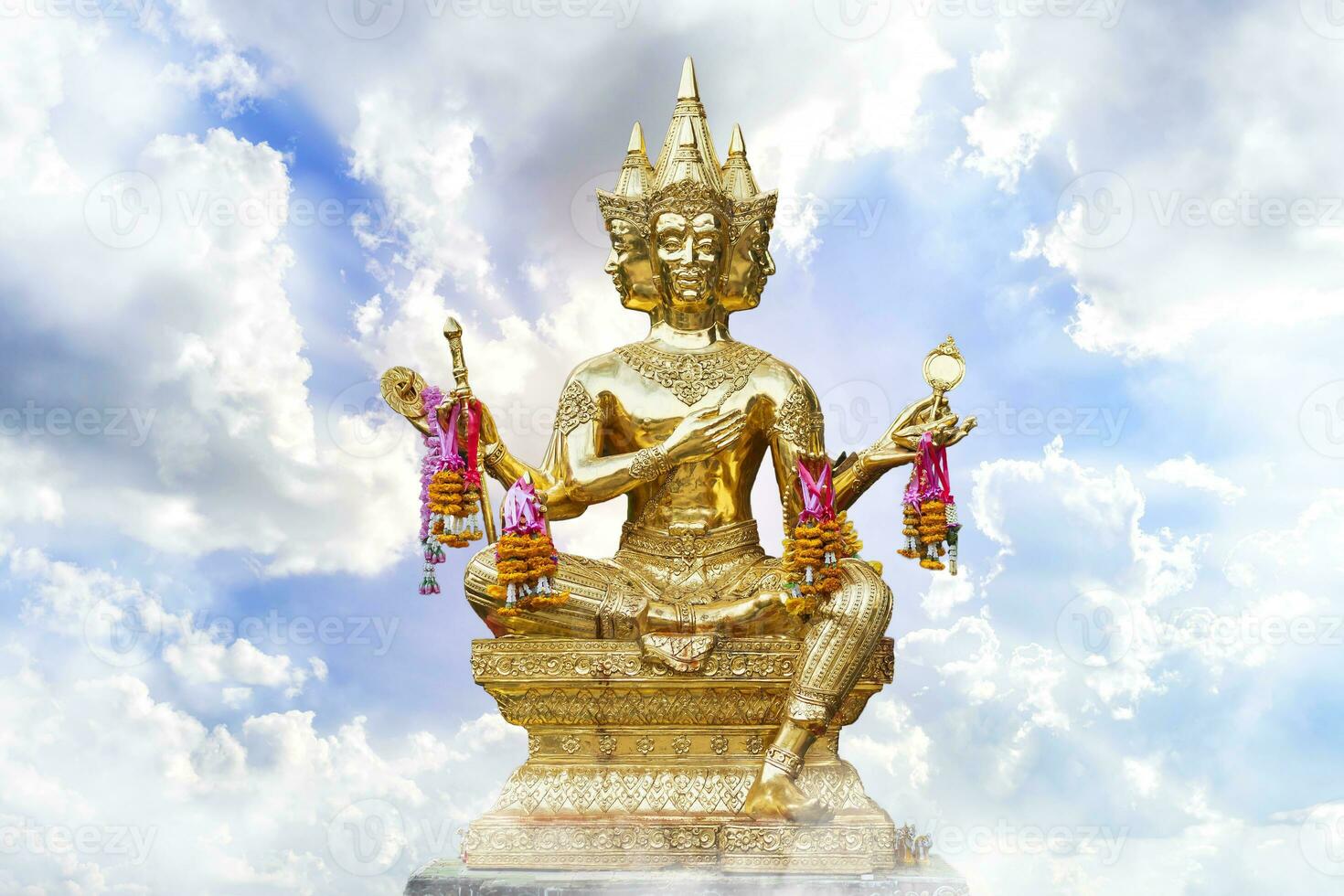 Golden of Brahma statue religious with blue sky with white spindrift very clouds background of thailand. photo