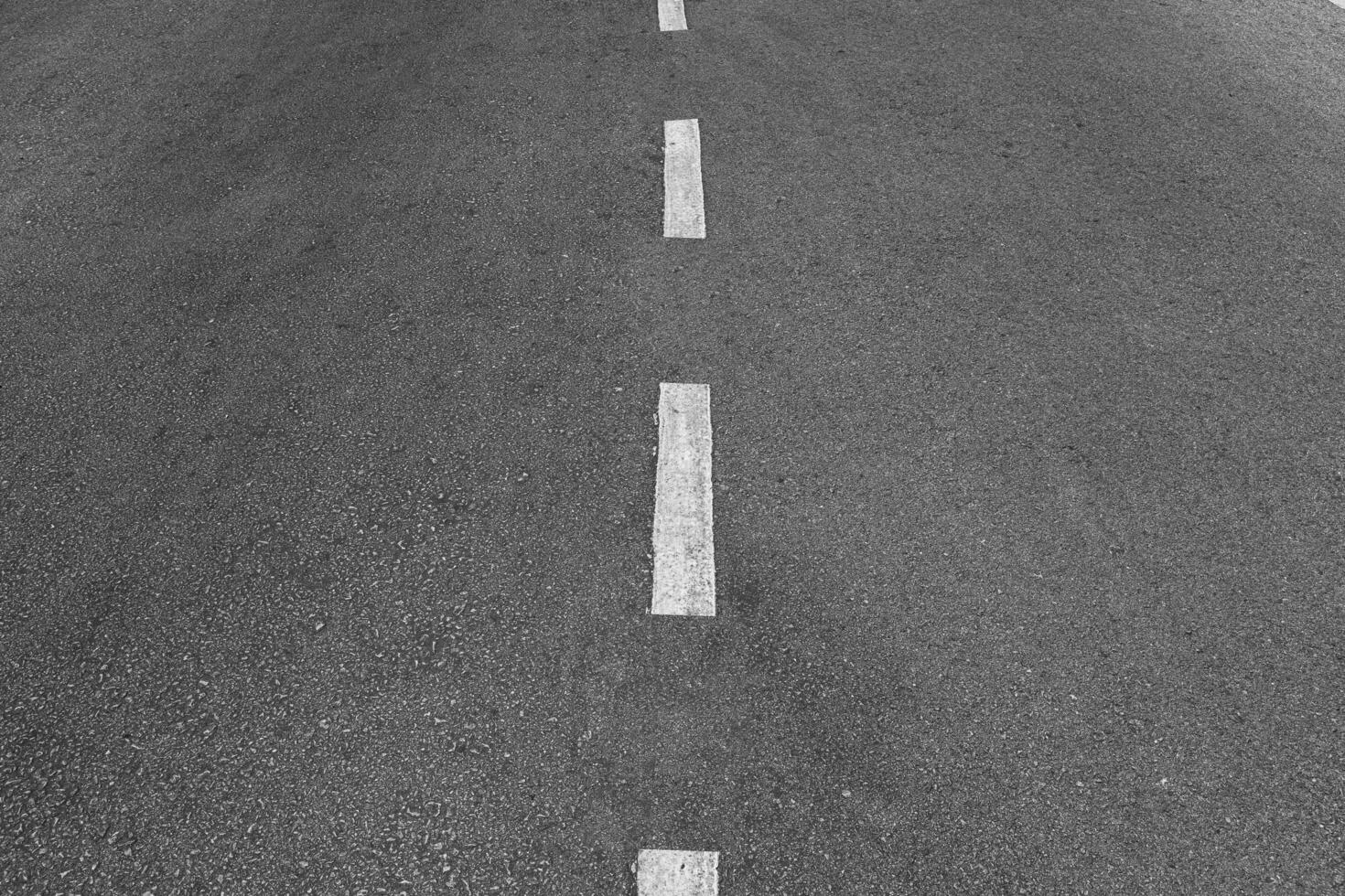 Asphalt road with marking lines white stripes texture Background. photo