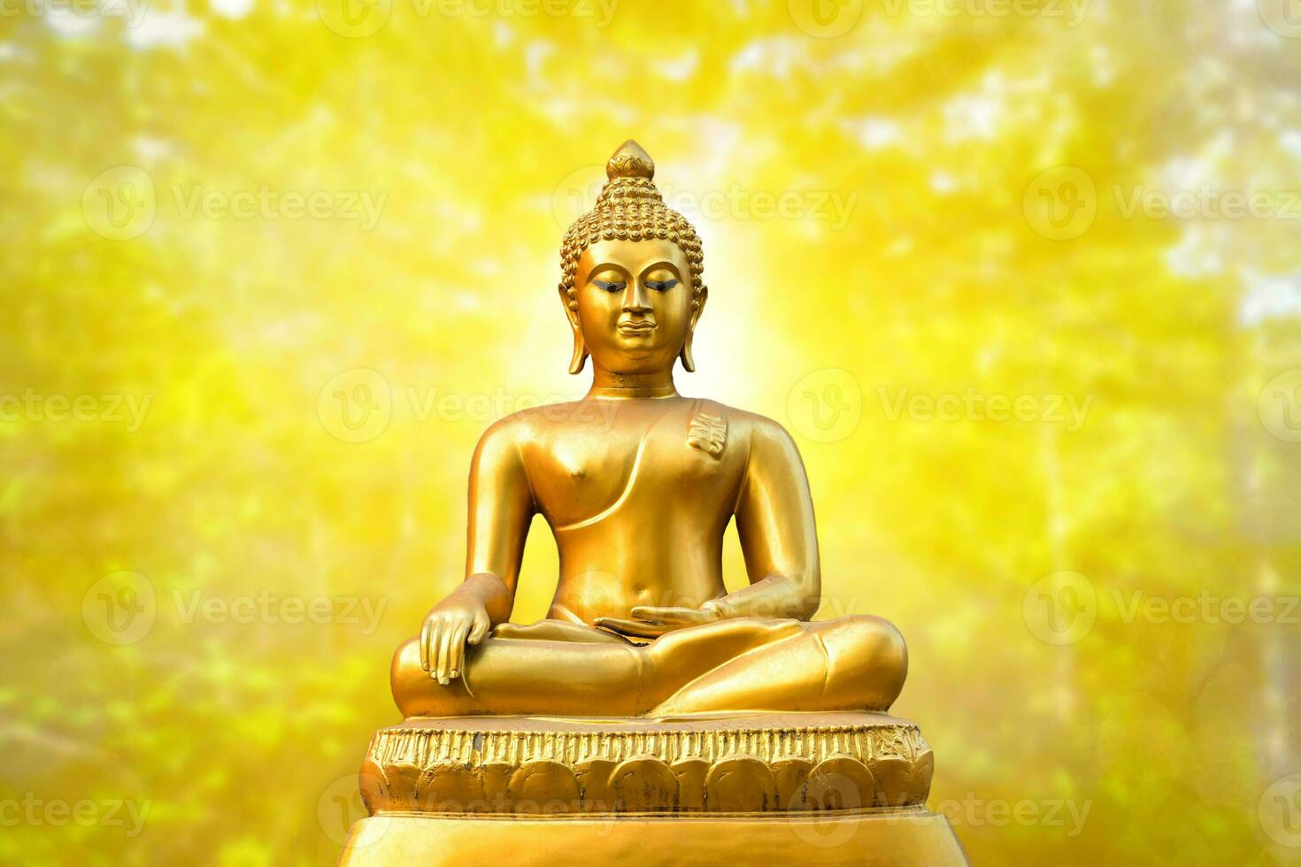 Beautiful of Golden Buddha statue on golden yellow bokeh background. photo