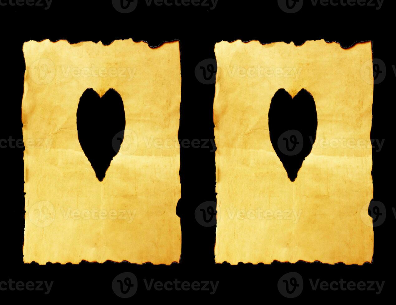 old paper sheet with heart symbol on black background photo