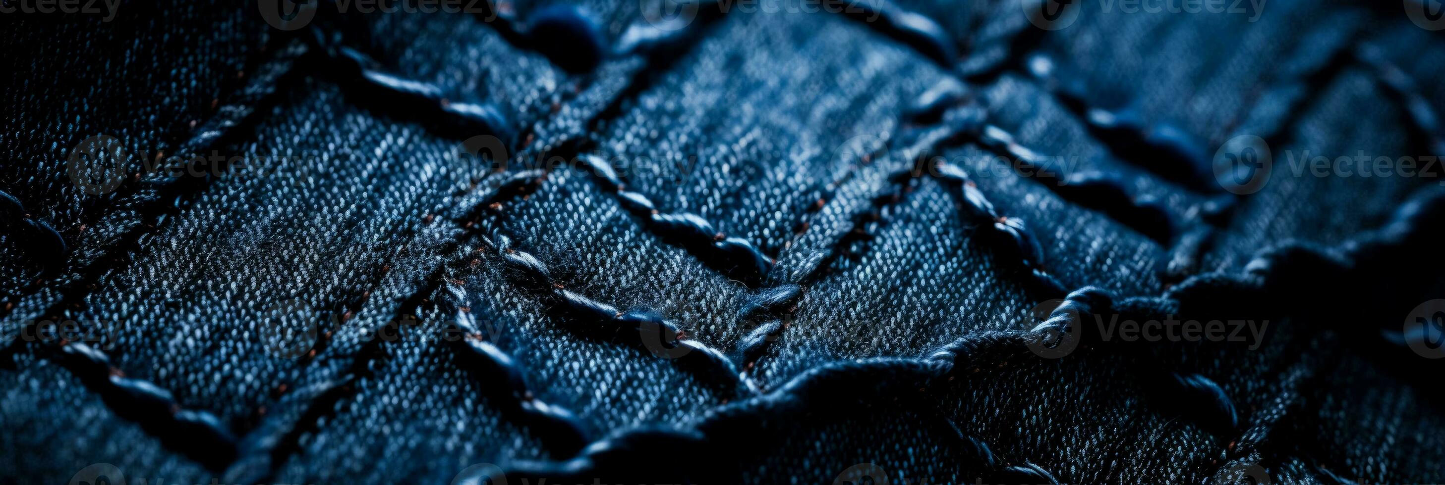 Detailed macros highlighting meticulous stitch patterns on textured denim backgrounds photo