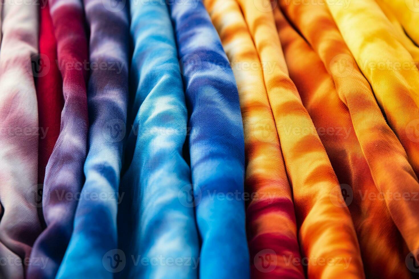 Macro shots of psychedelic tie dye patterns on different textile surfaces photo