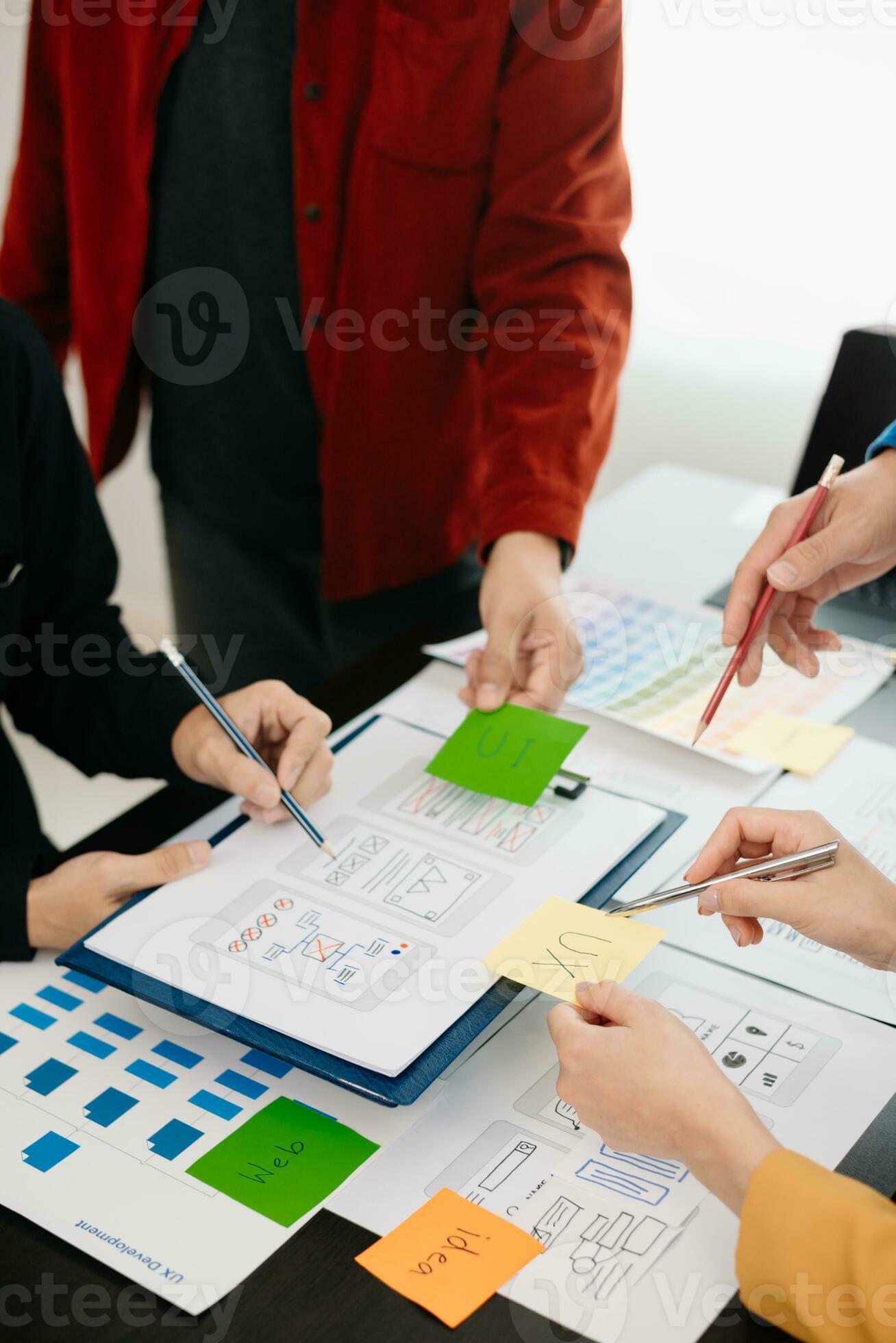 UX developer and ui designer brainstorming about mobile app interface ...