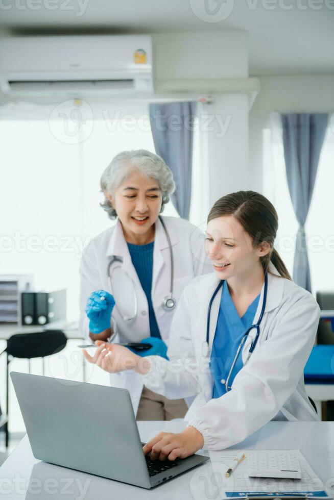 Hospital Ward. Doctor Talks With Professional Head Nurse or Surgeon, They Use Digital tablet Computer. Diverse Team of Health Care Specialists Discussing Test Result photo
